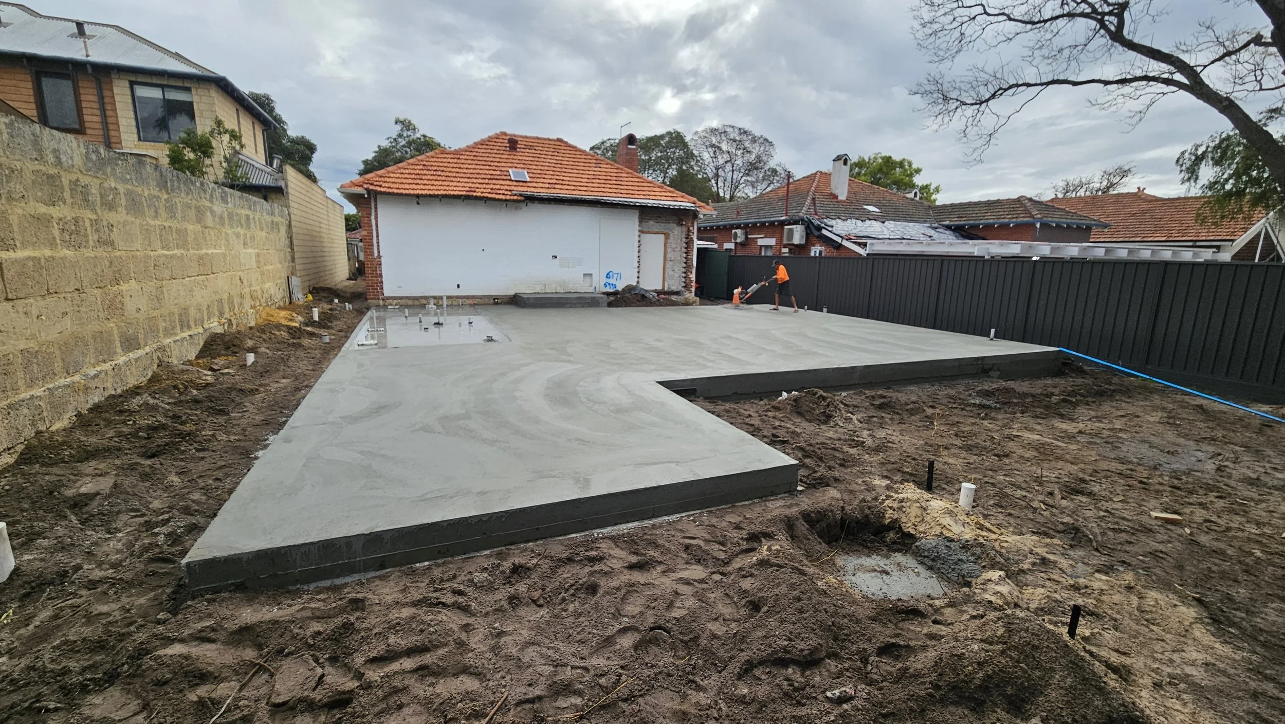 Grey concrete house extension to slab in South Perth