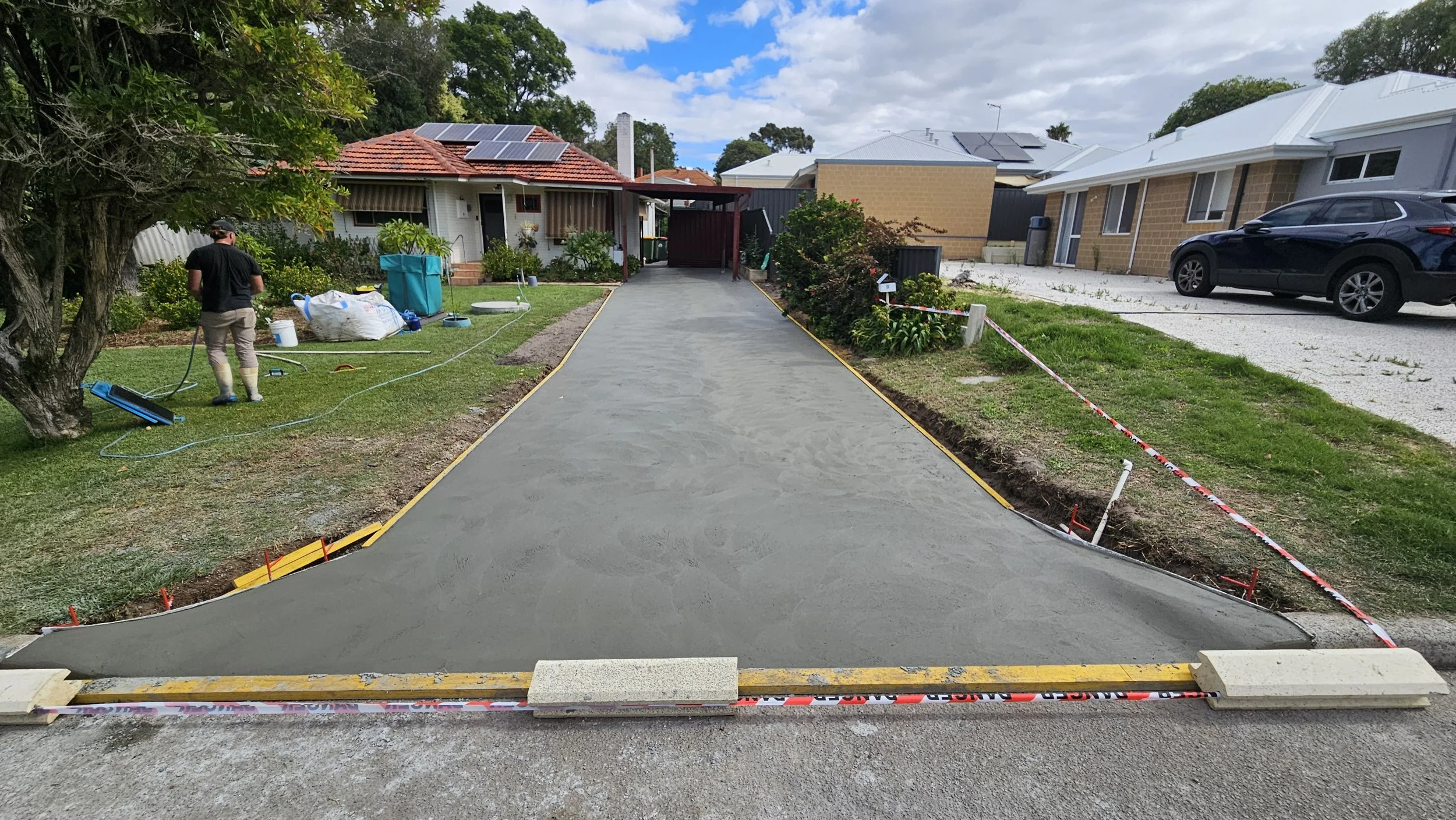 Fresh grey concrete pour to driveway and crossover in Eden Hill