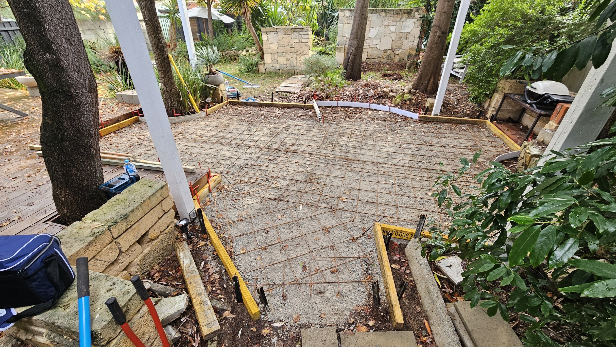 Site preparation and reinforcement for grey concrete to alfresco and patio slab in Hilton