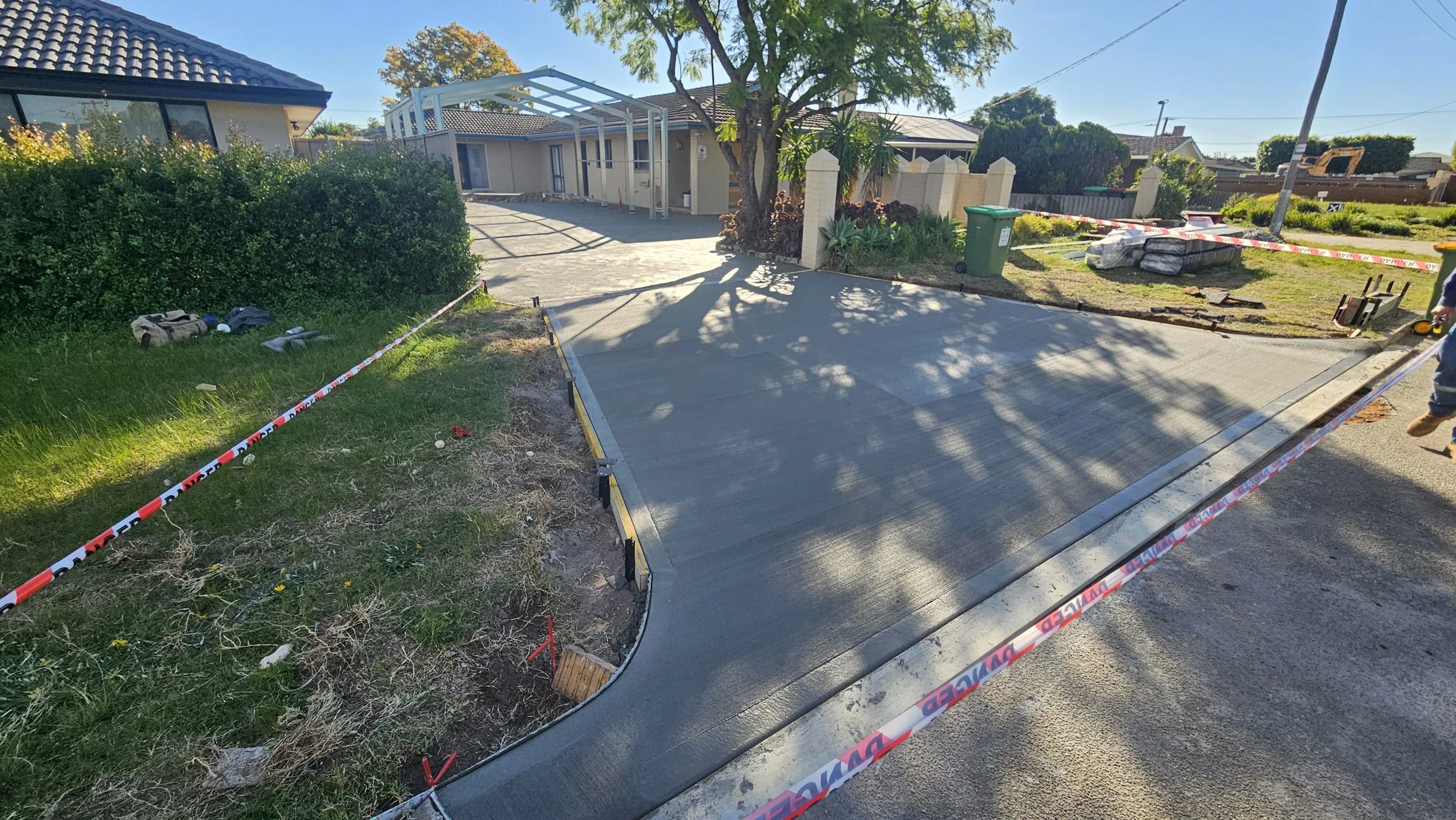 Grey concrete driveway crossover in Morley