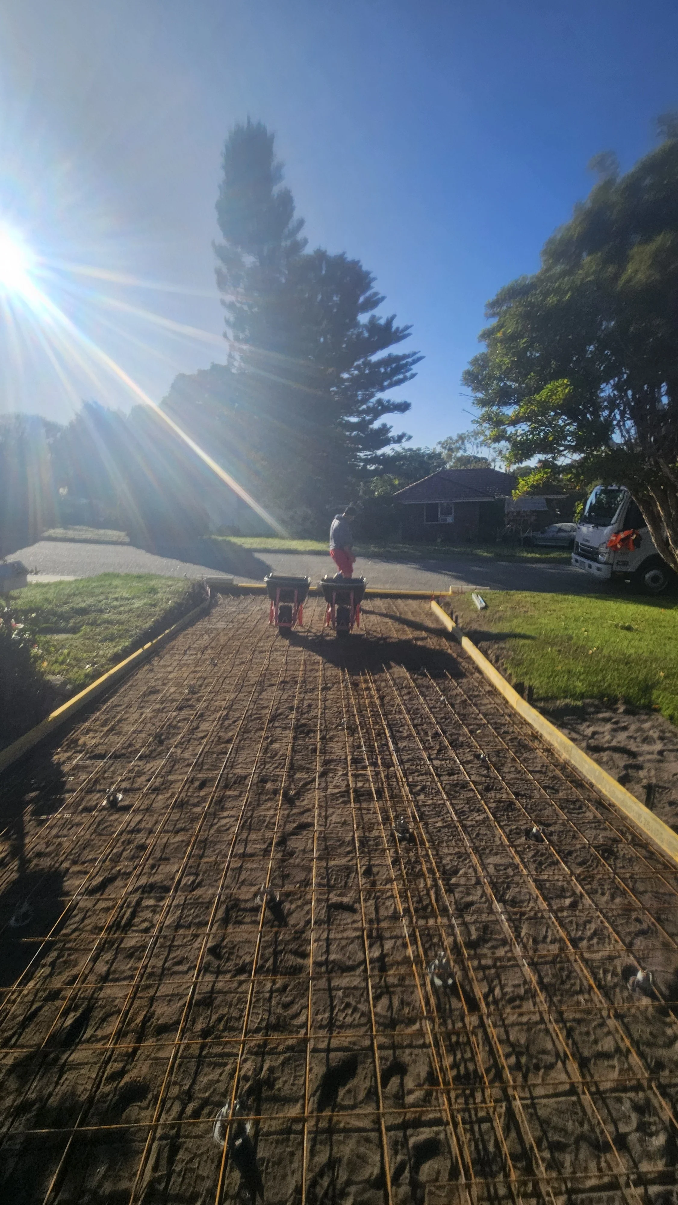 Driveway concrete removal and subgrade levels with reinforcement mesh