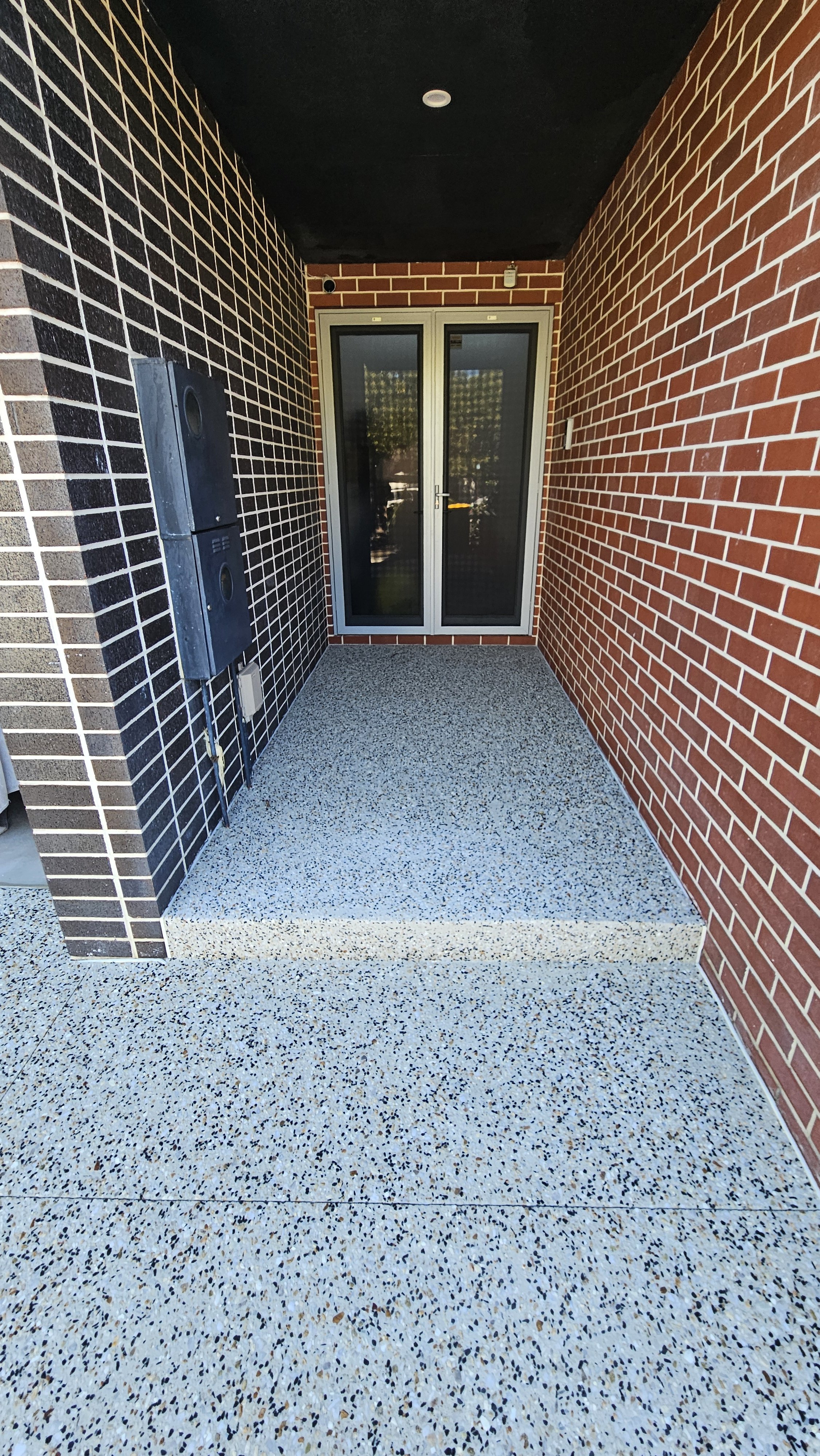 Exposed aggregate porch and step in North Perth