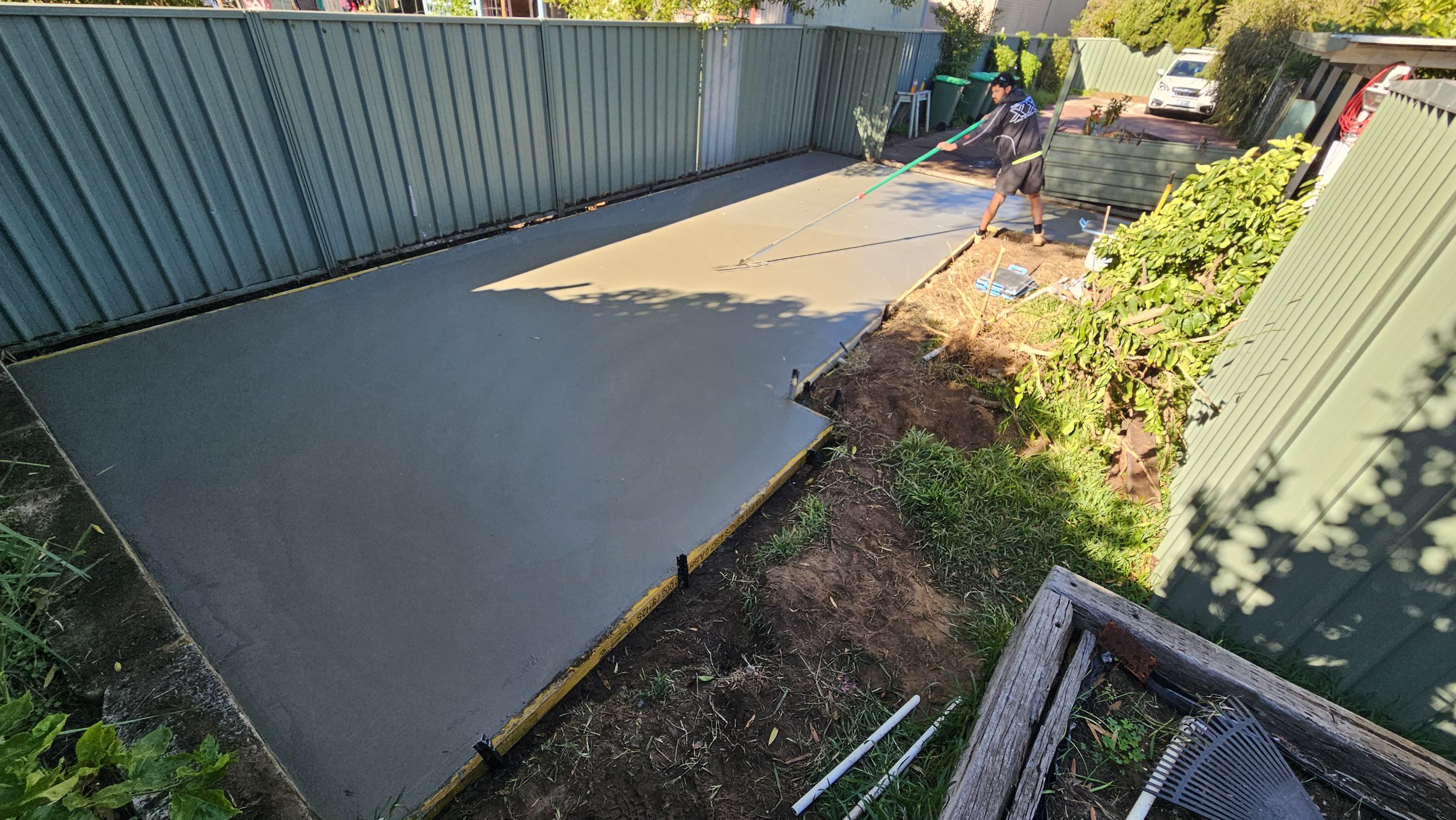 Grey concrete shed slab freshly poured in Palmyra