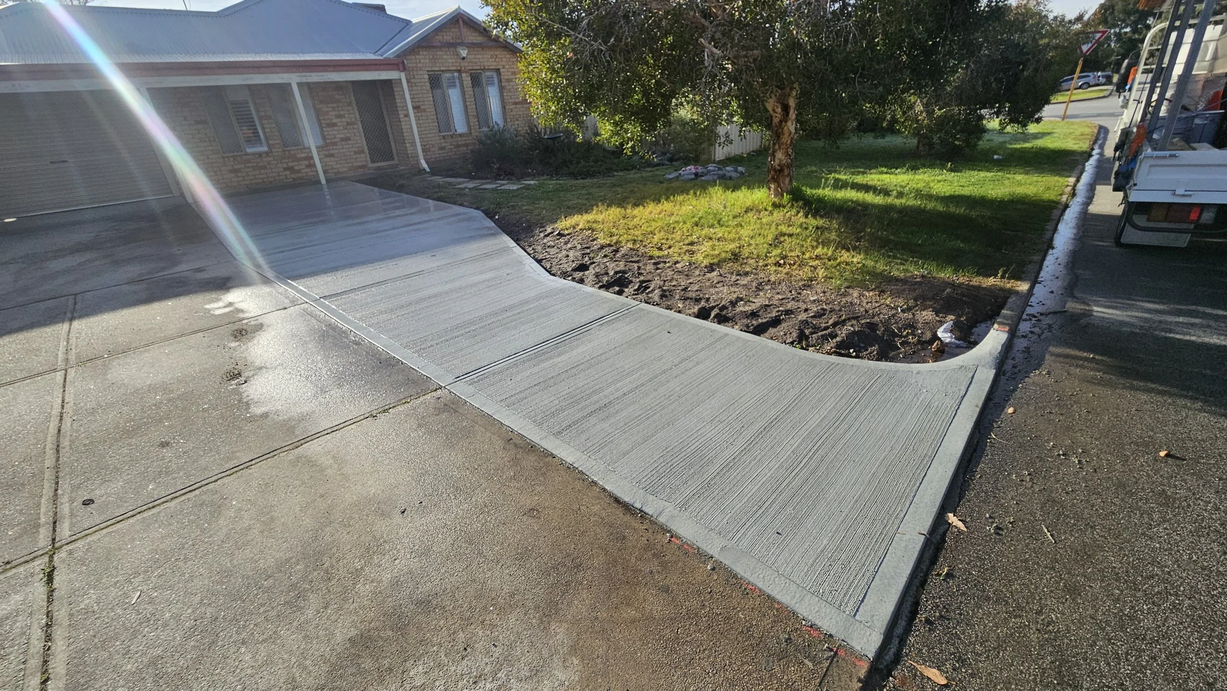 Grey concrete driveway replacement in Ashfield