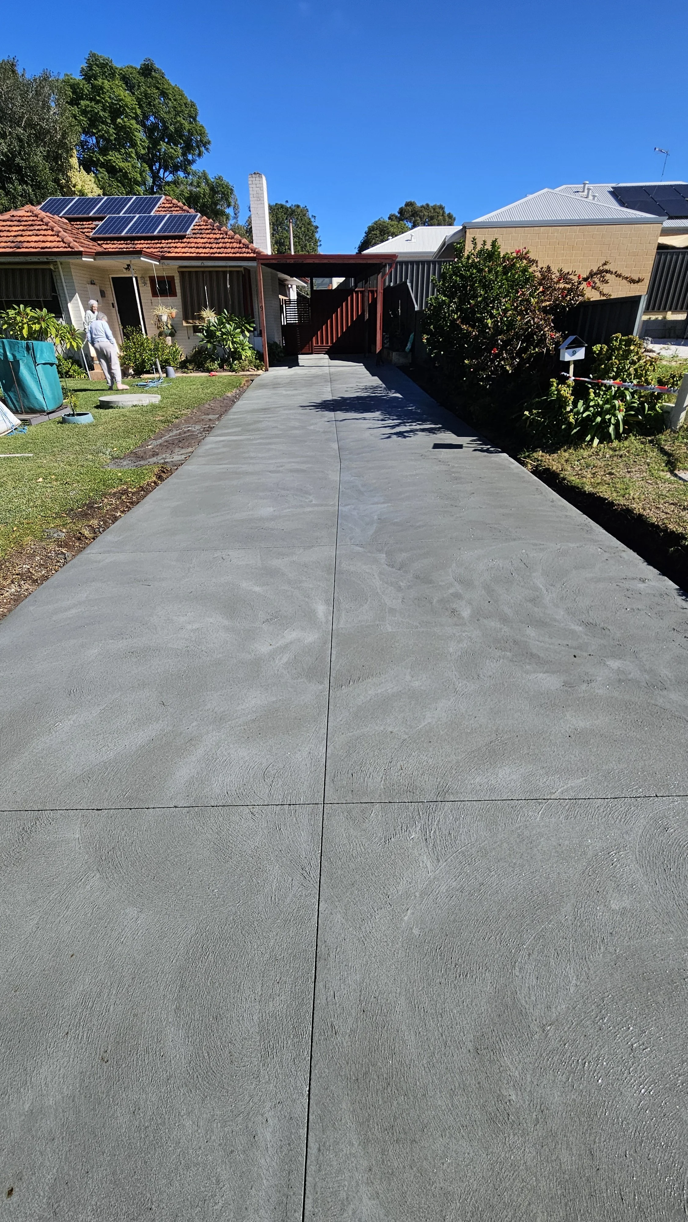 new grey concrete driveway and crossover with lines cut in Eden Hill