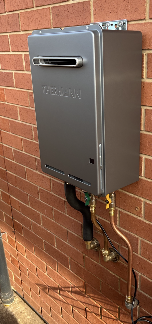 Licensed gasfitter connecting a gas appliance in an Adelaide home