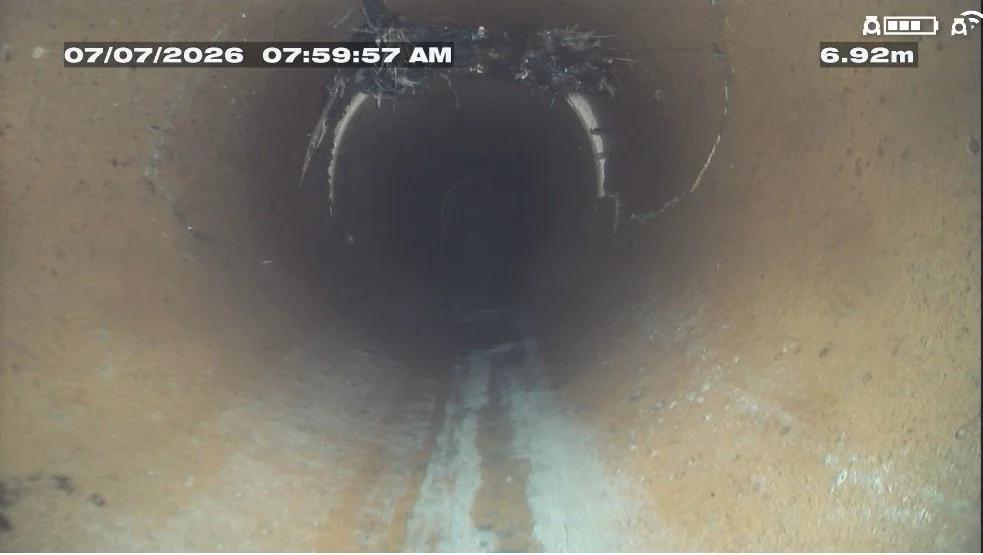 CCTV camera view inside a drain pipe showing a blockage during a drain inspection