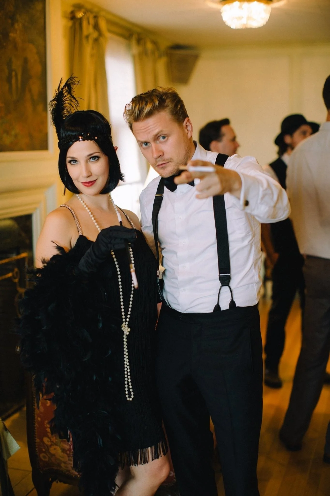People dressed in 1920s flapper costumes at a Reno, Nevada party.