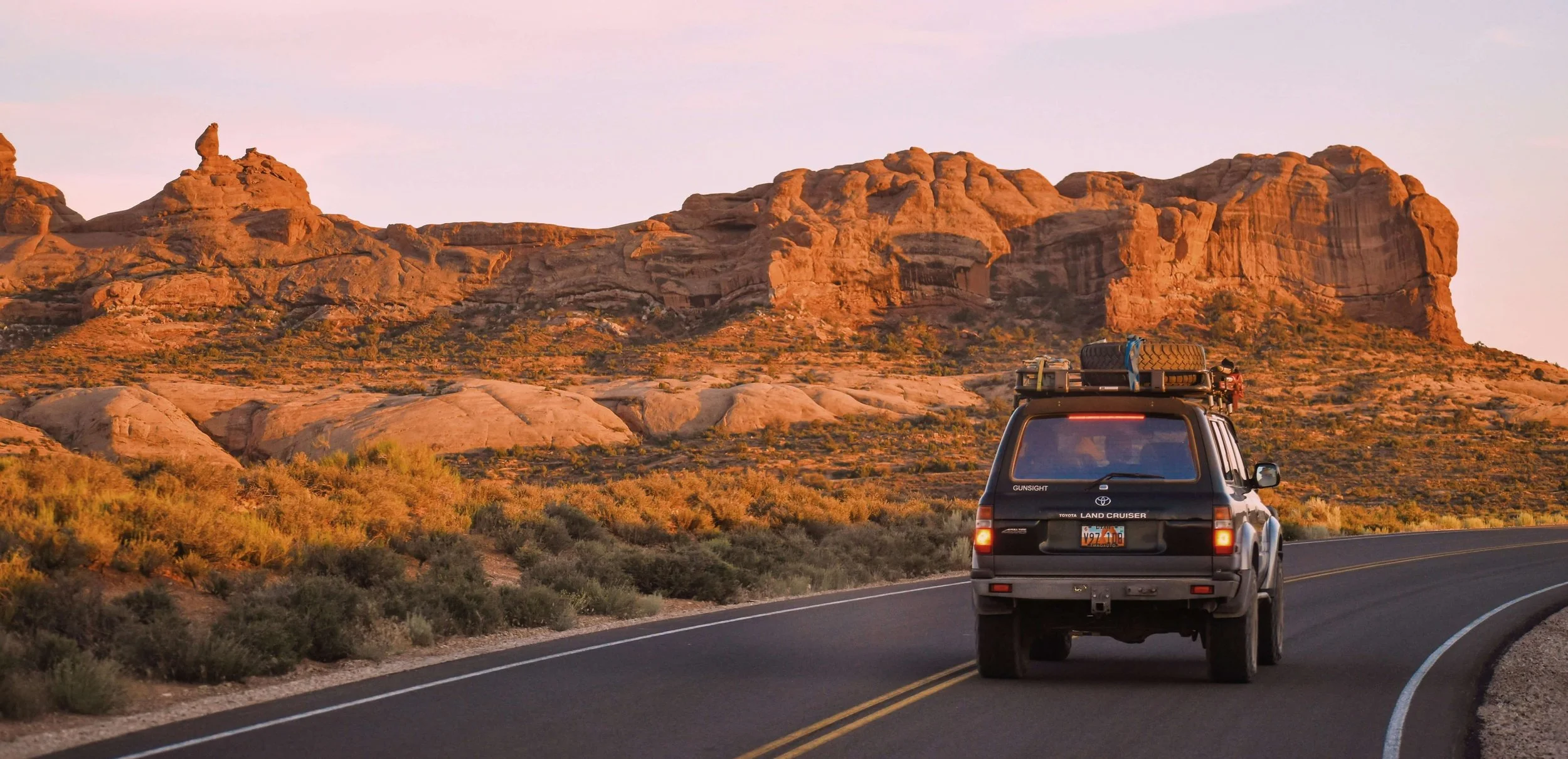 A Toyota Land Cruiser on the road in Moab, USA. Unsplash.