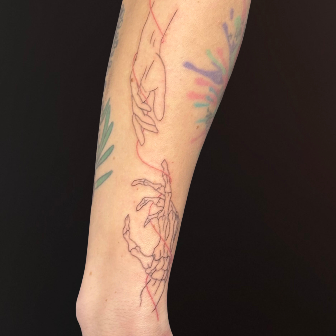 Fine Line Skeleton Hand Tattoo Red String of Fate.png