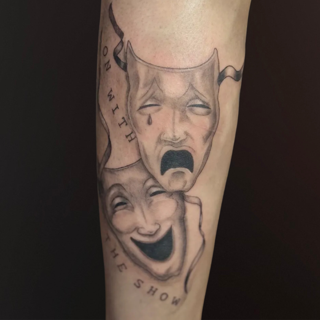 Drama Mask Leg Tattoo.png