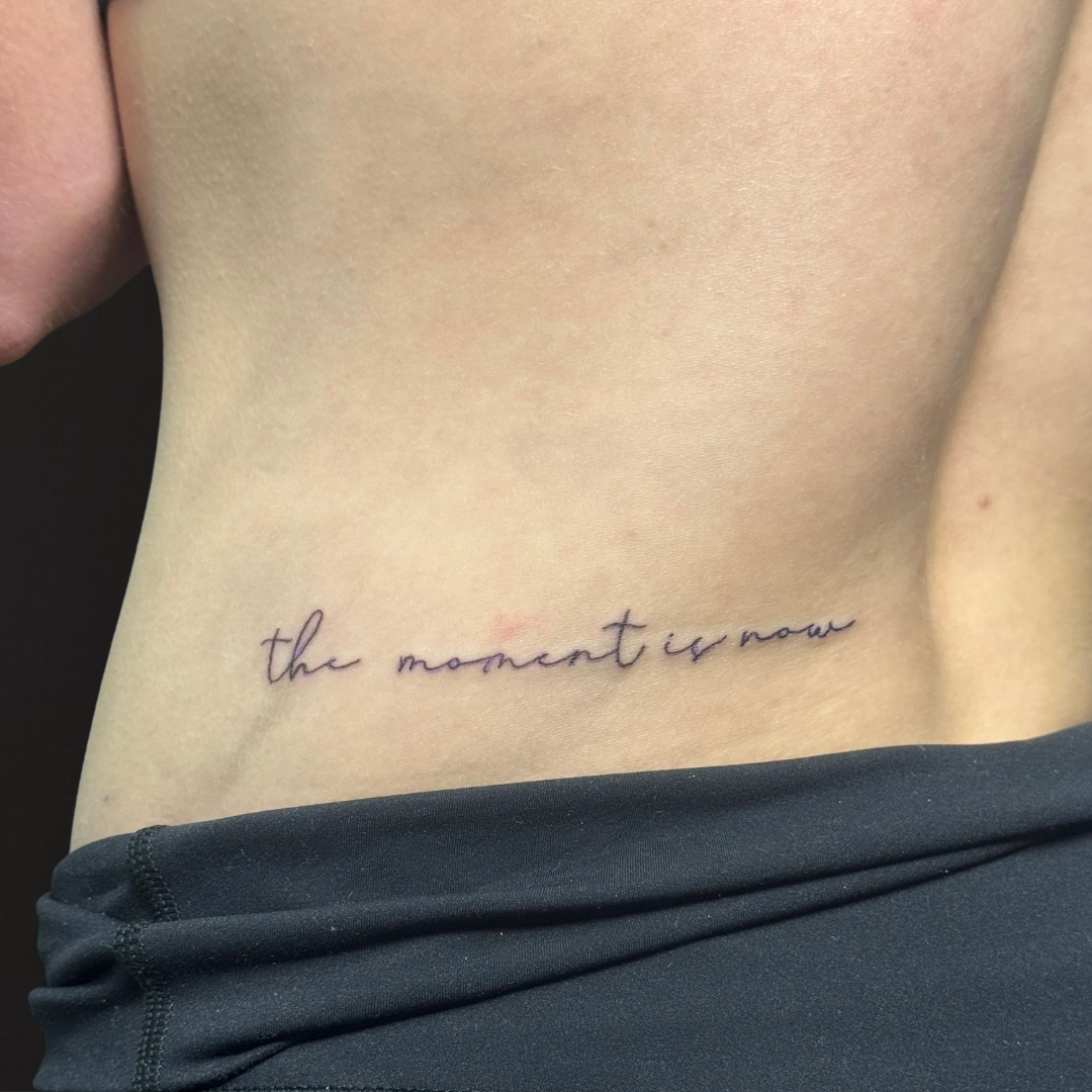 Fine Line Script Font Lower Back Tattoo.png
