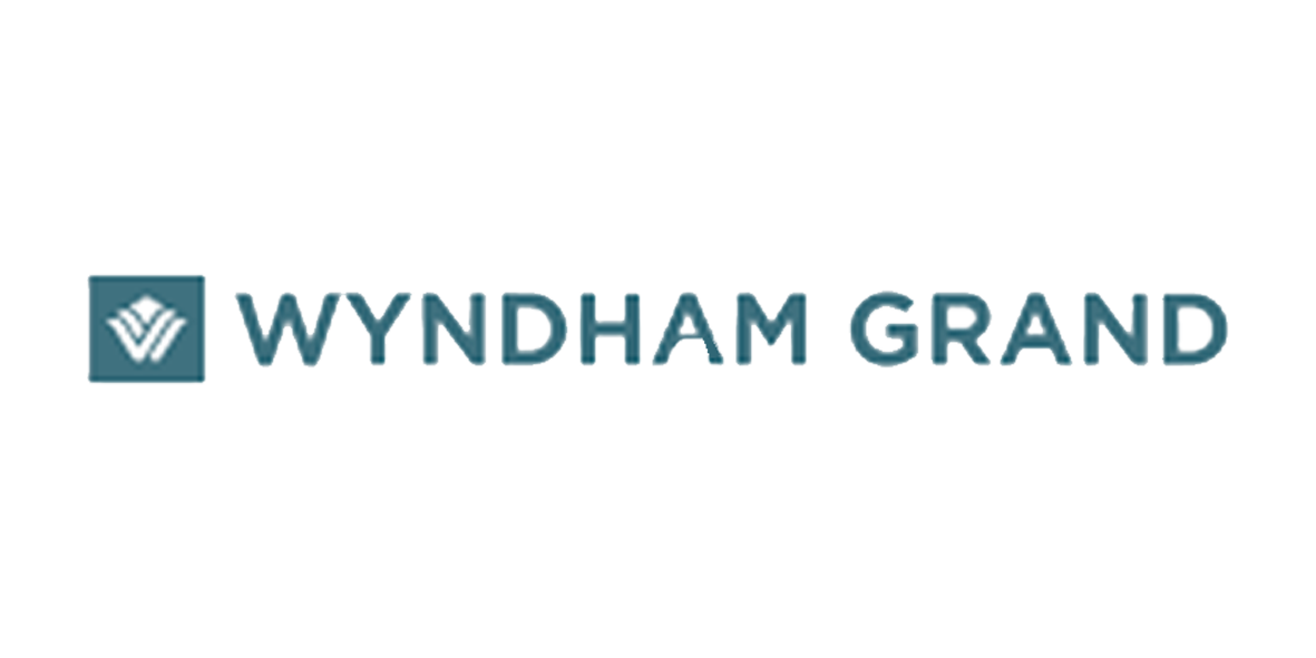 Wyndham Grand logo with blue emblem and text.