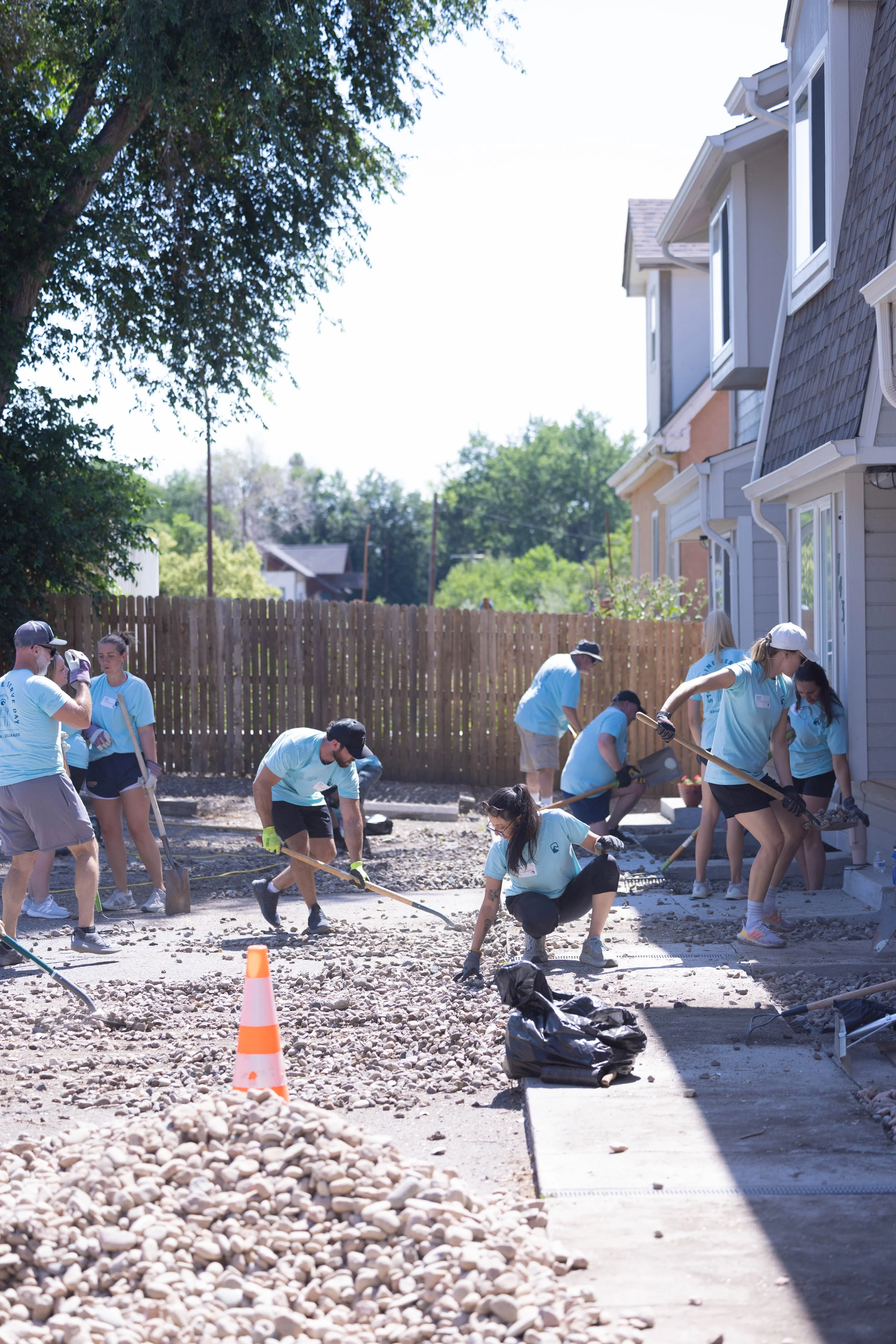 Three men being baptized in a church, with two in water and one celebrating.
