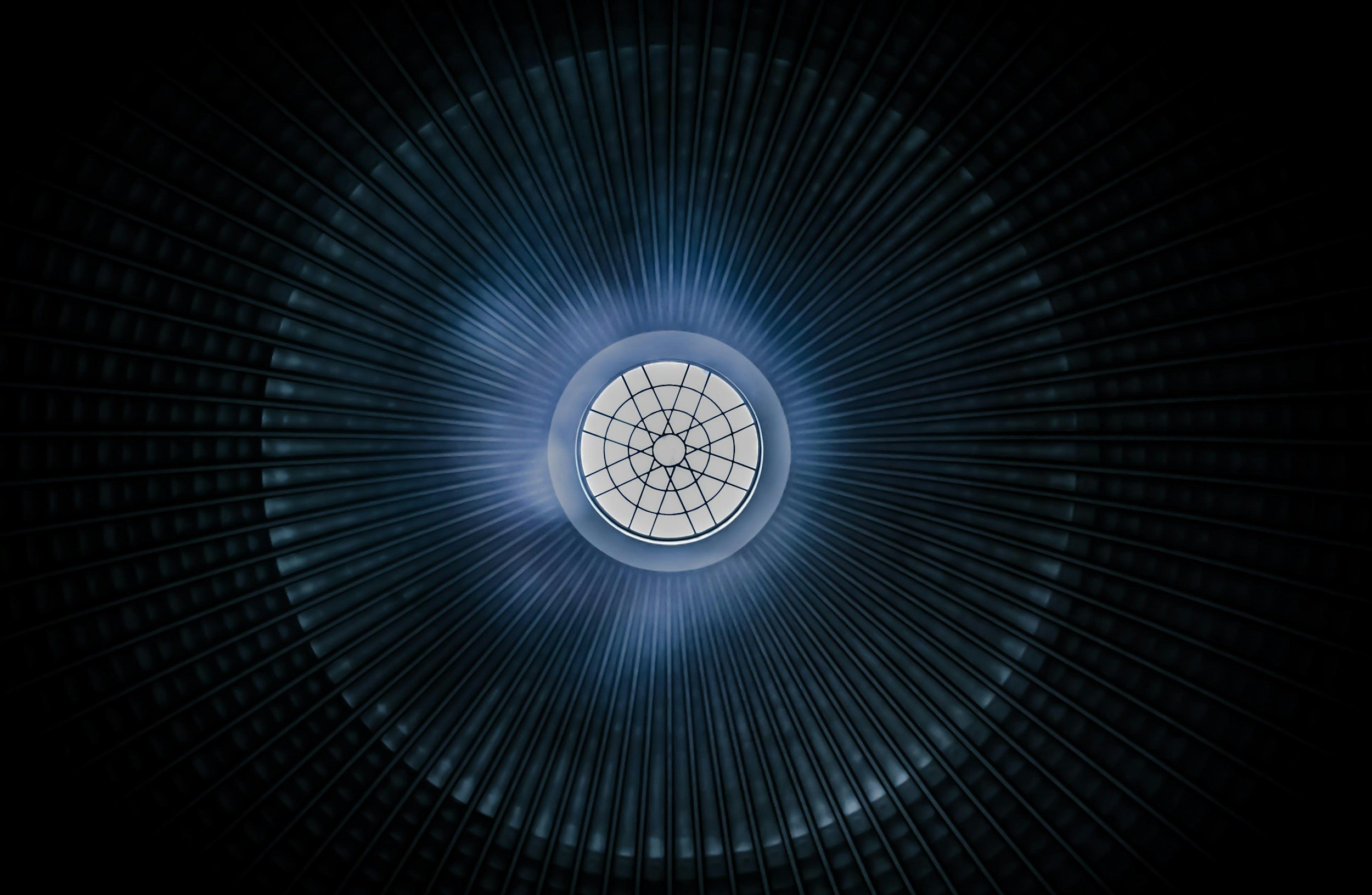 View looking up inside a large, cylindrical, metallic structure with ribs, with a circular window at the top emitting blue light.
fantasy ghostwriting
fantasy novel
worldbuilding
epic fantasy
fantasy author