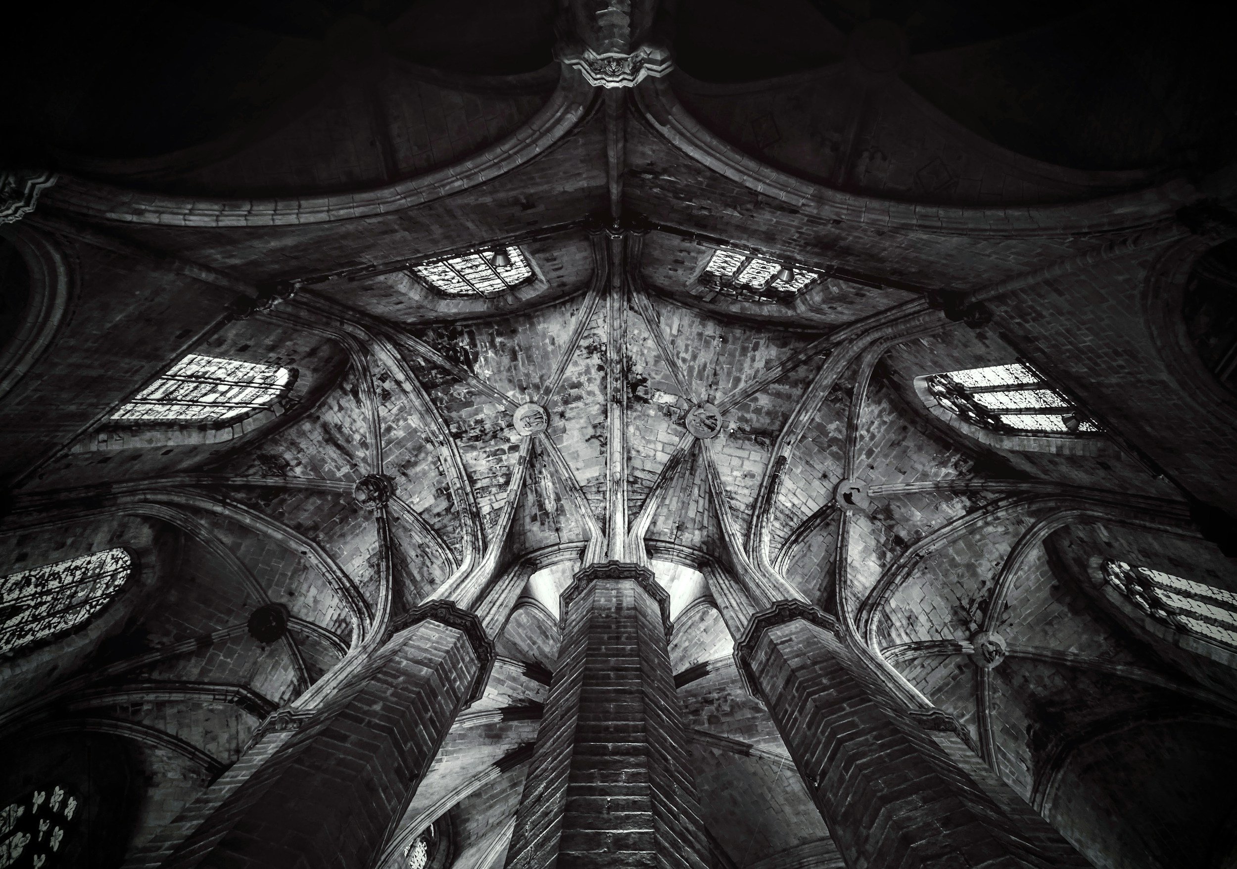Inside view of a Gothic cathedral ceiling, showcasing detailed stonework, ribbed vaults, and stained glass windows.
fantasy ghostwriting
fantasy novel
worldbuilding
epic fantasy
fantasy author