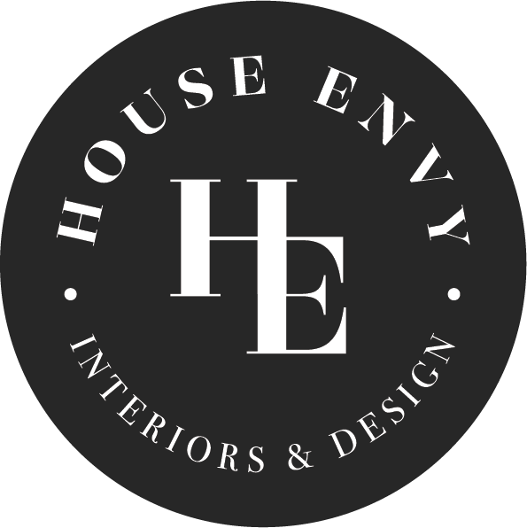 Logo for 'House Envy Interiors & Design' with initials H, E in the center, surrounded by the text 'House Envy Interiors & Design' in a circular pattern.