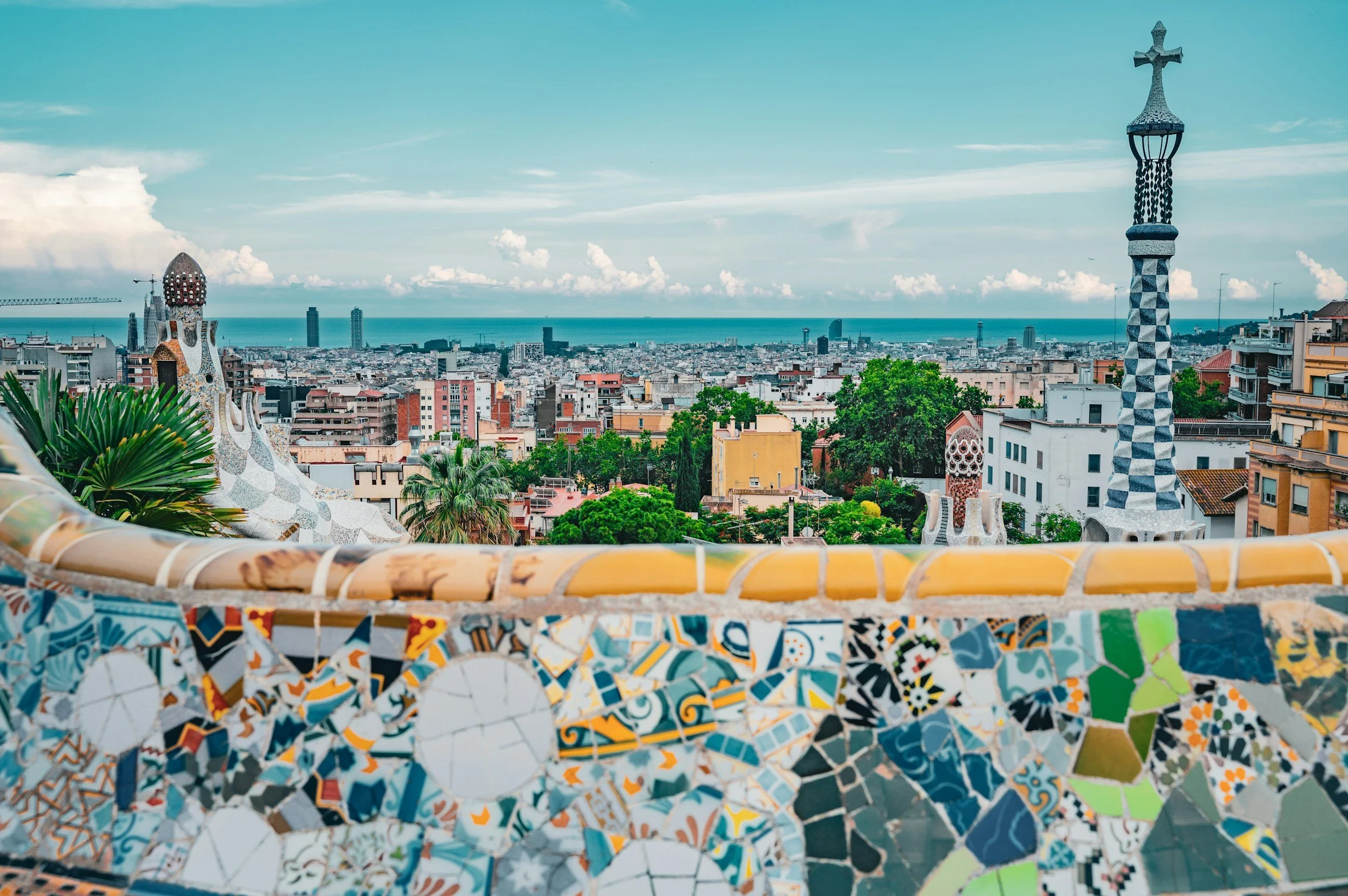 Park Güell mosaic terrace overlooking Barcelona skyline