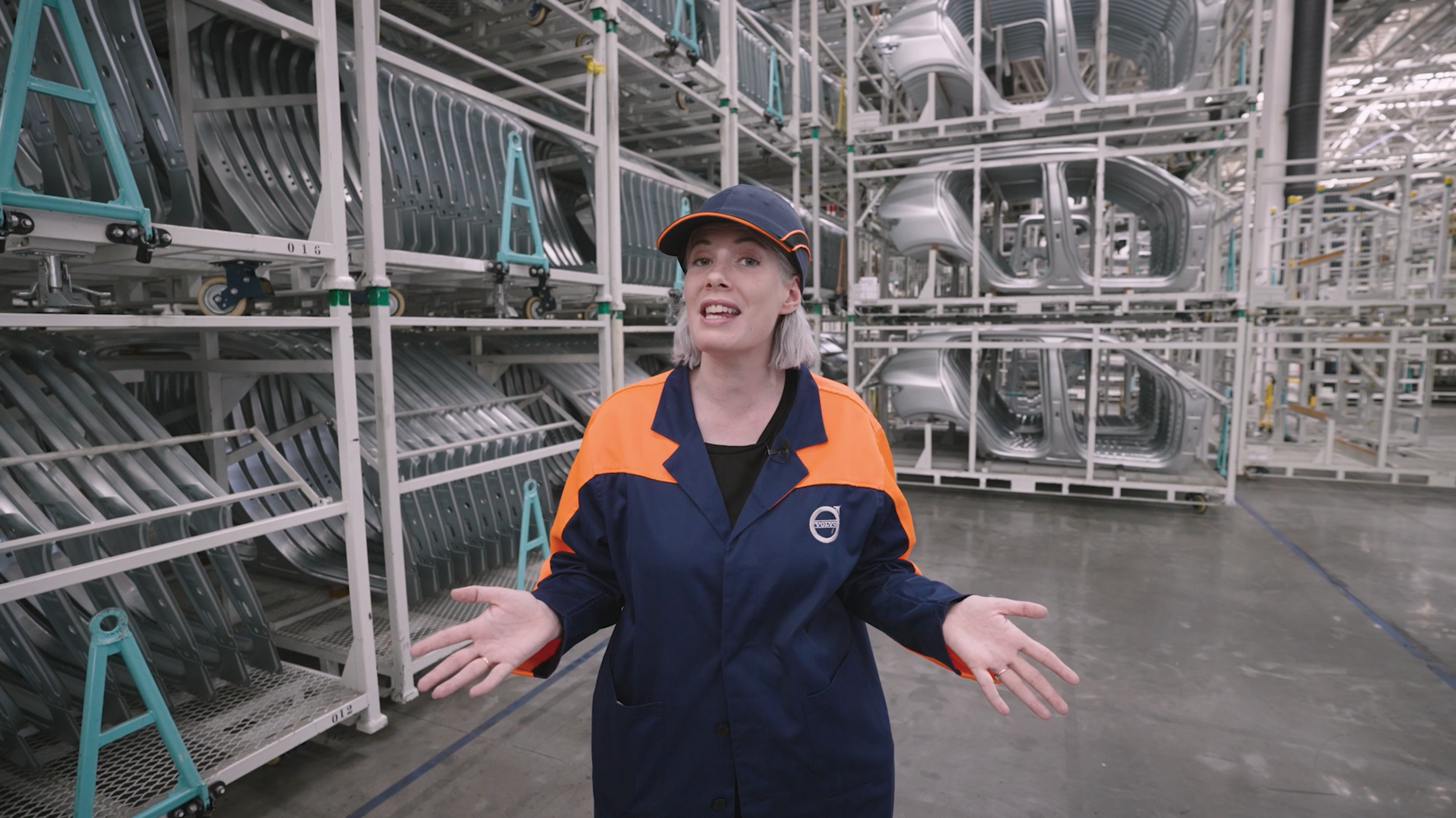 women wearing a Volvo uniform in a car factory