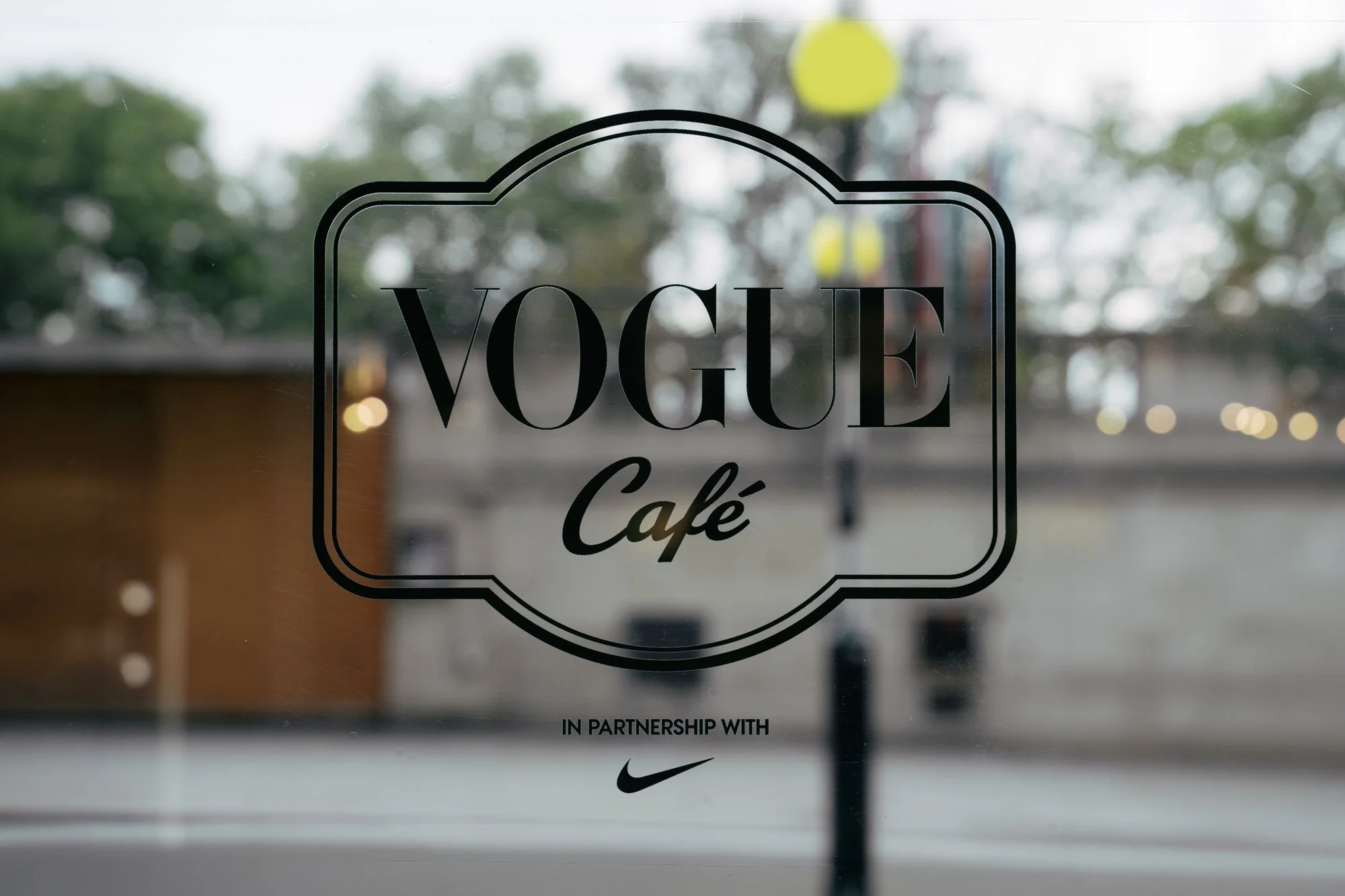Guests at long tables inside the Vogue Café x Nike at Corner Shop during London Fashion Week