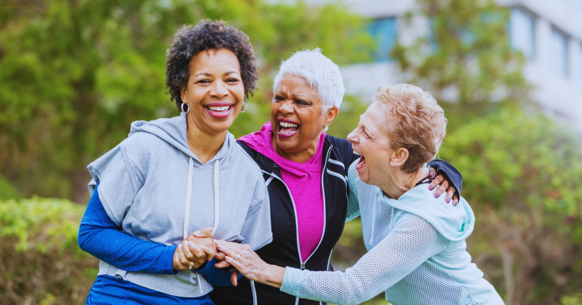 Image of middle-aged ladies being social and enjoying the outdoors. Social contact reduces our risk of Alzheimer's Disease, according to Atlanta-based concierge longevity Dr. Gregory Charlop