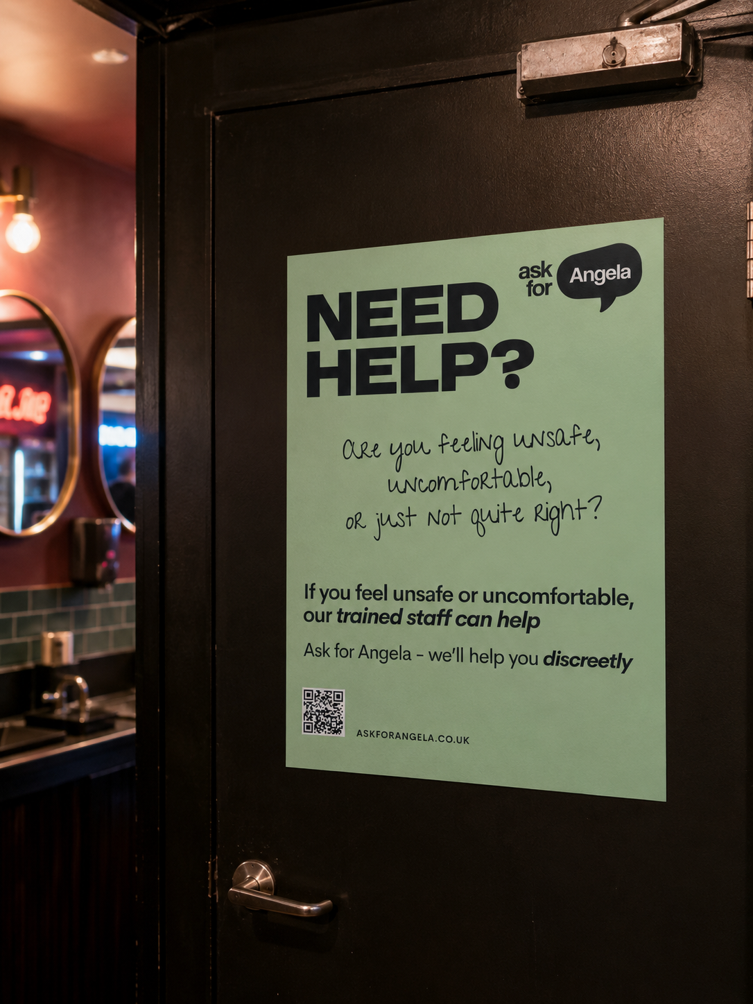 Green Ask for Angela 'Need Help' poster on the back of a toilet cubicle door