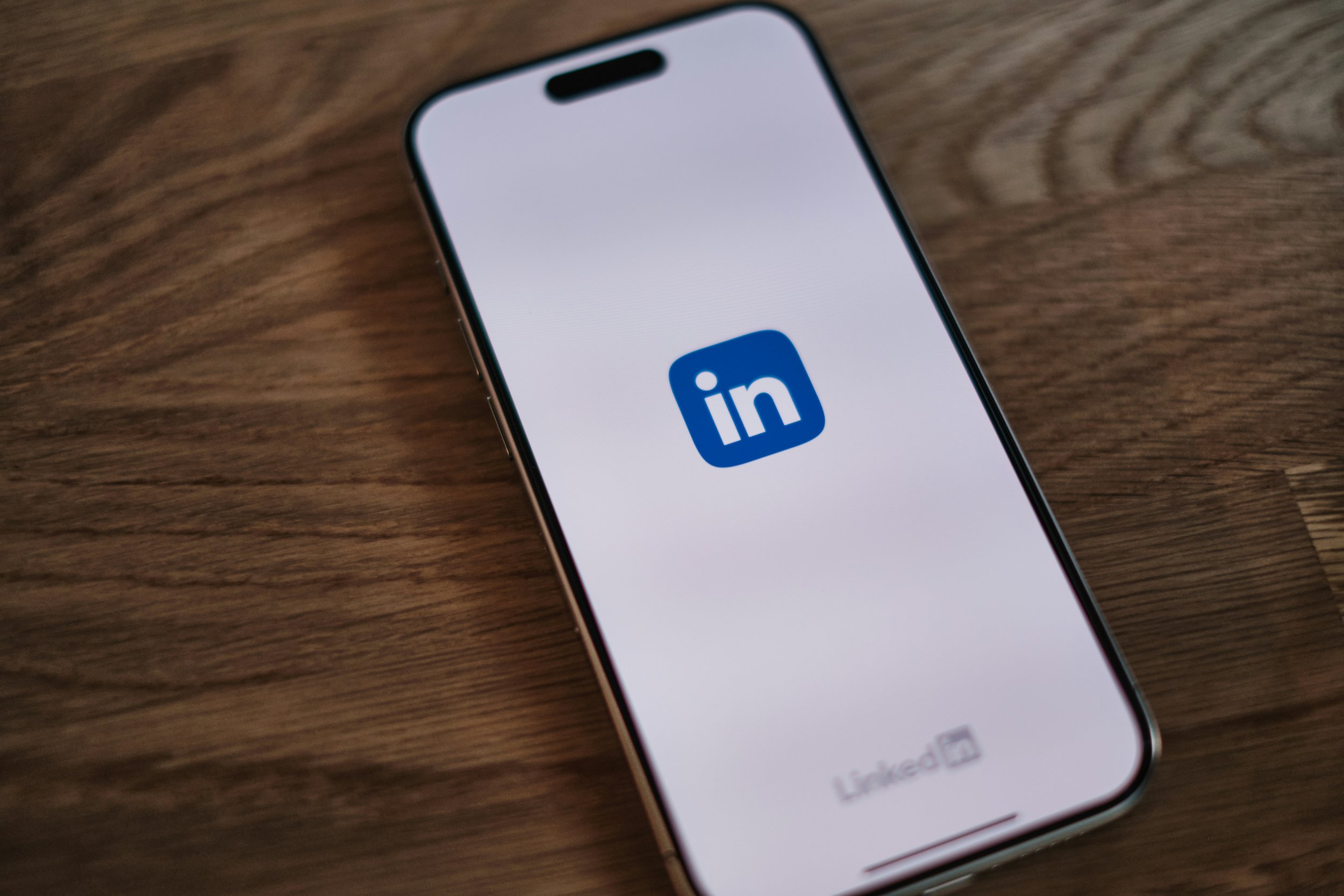 Blue LinkedIn logo displayed on smartphone