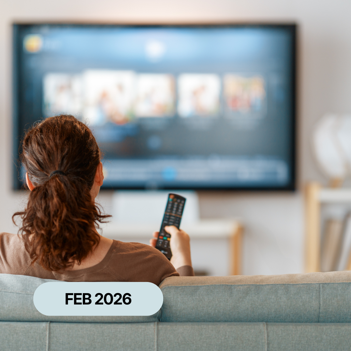 A person watching television in a living room