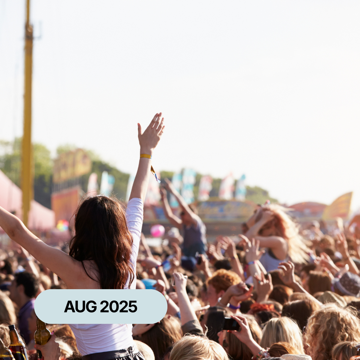 A large crowd celebrating at an outdoor festival