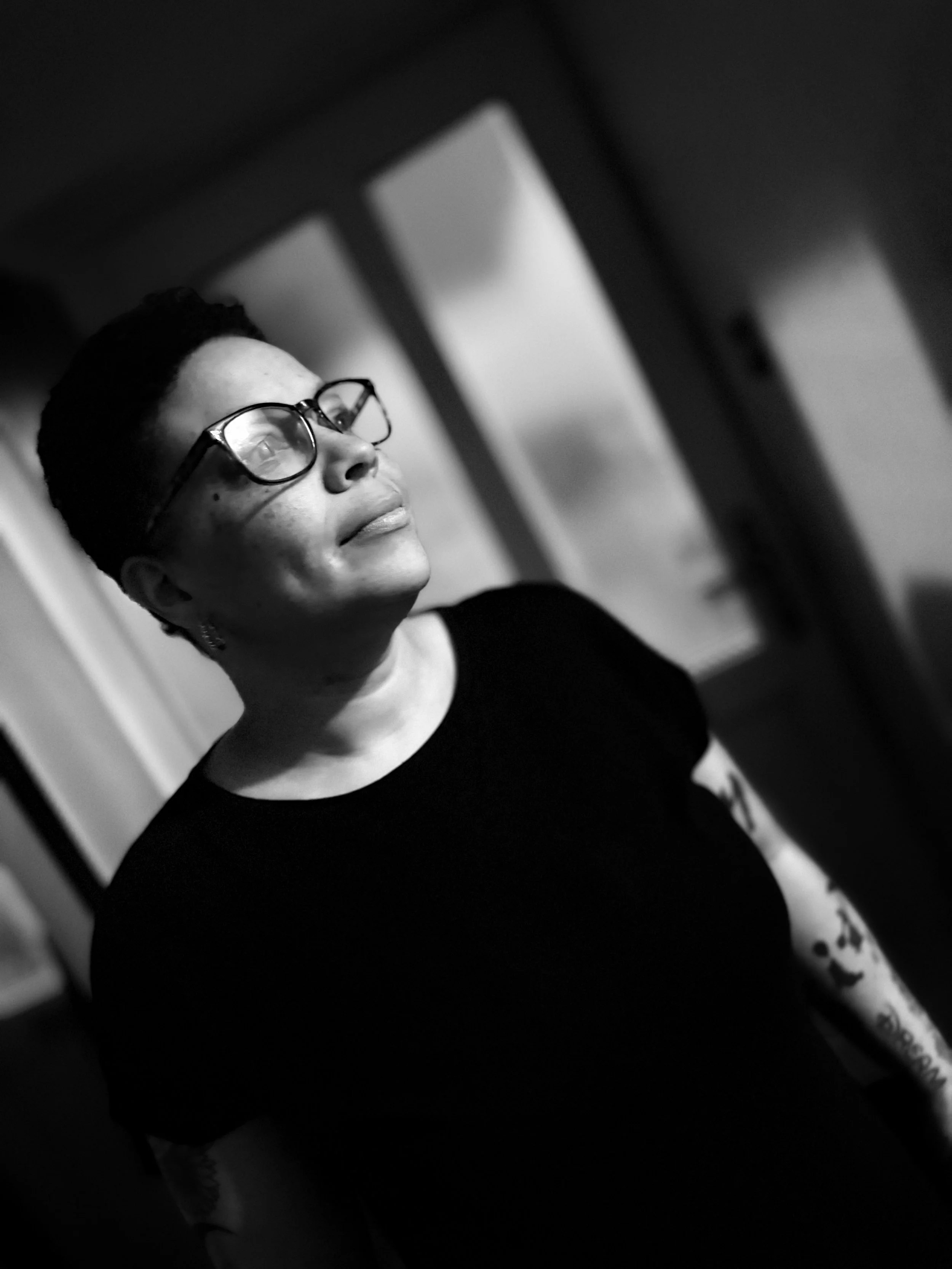Black and white portrait of Stephanie Todd, Deaf founder of WovenAware, representing Deaf awareness and lived experience storytelling.