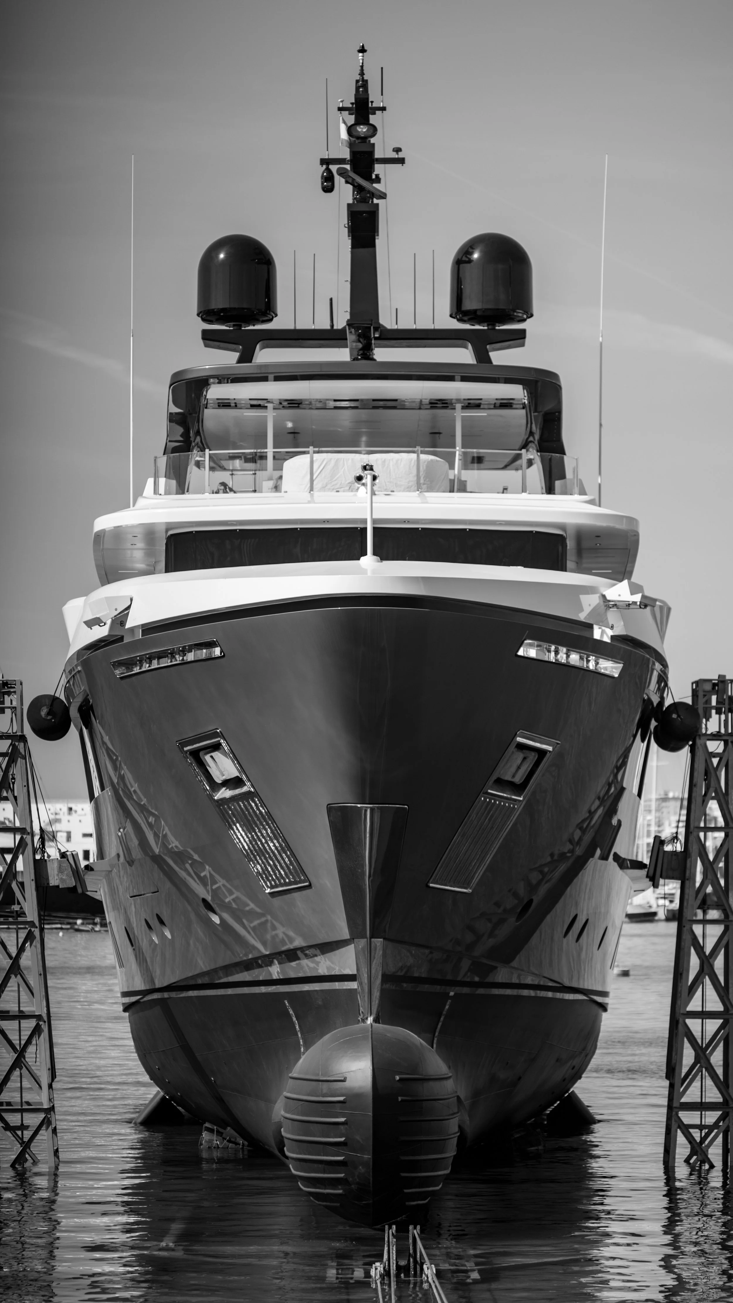 Yacht Arrow being lifted out of the water in the shipyard
