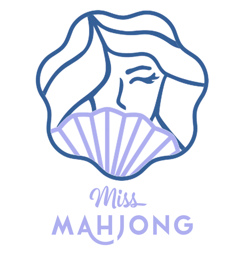 Line art illustration of a woman’s face with flowing hair, partially covered by a seashell, with the text 'The MâyHòng' below.
