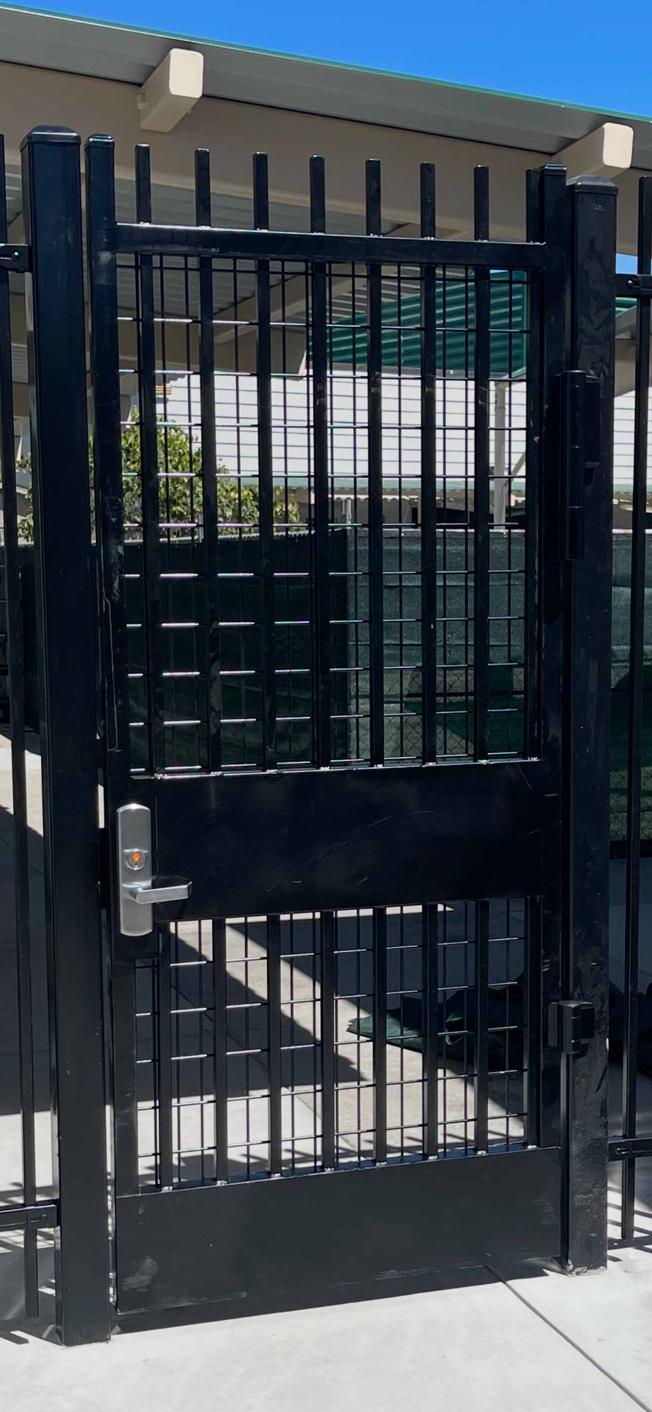 Commercial steel security door gate installed for restricted building access