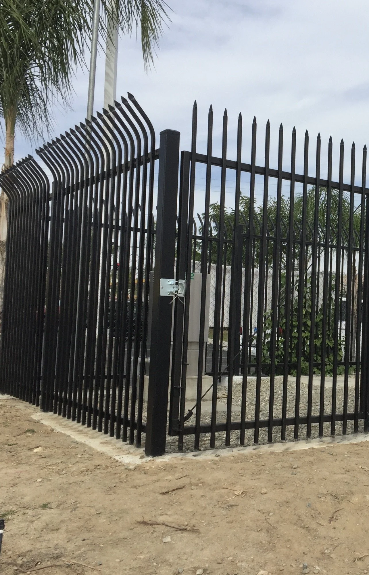 Ornamental iron security gate providing controlled access entry point