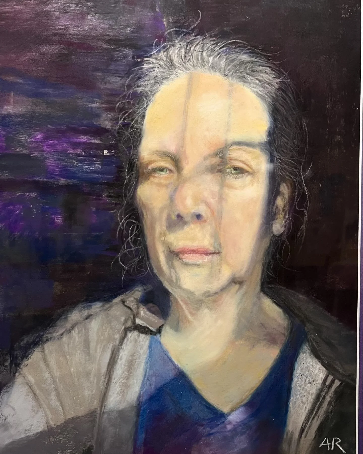 Self portrait in pastel. I got some negative feedback from family members. The image is not pretty but that&rsquo;s not what I was going for. I took this selfie when the light was filtering in from a window blind.