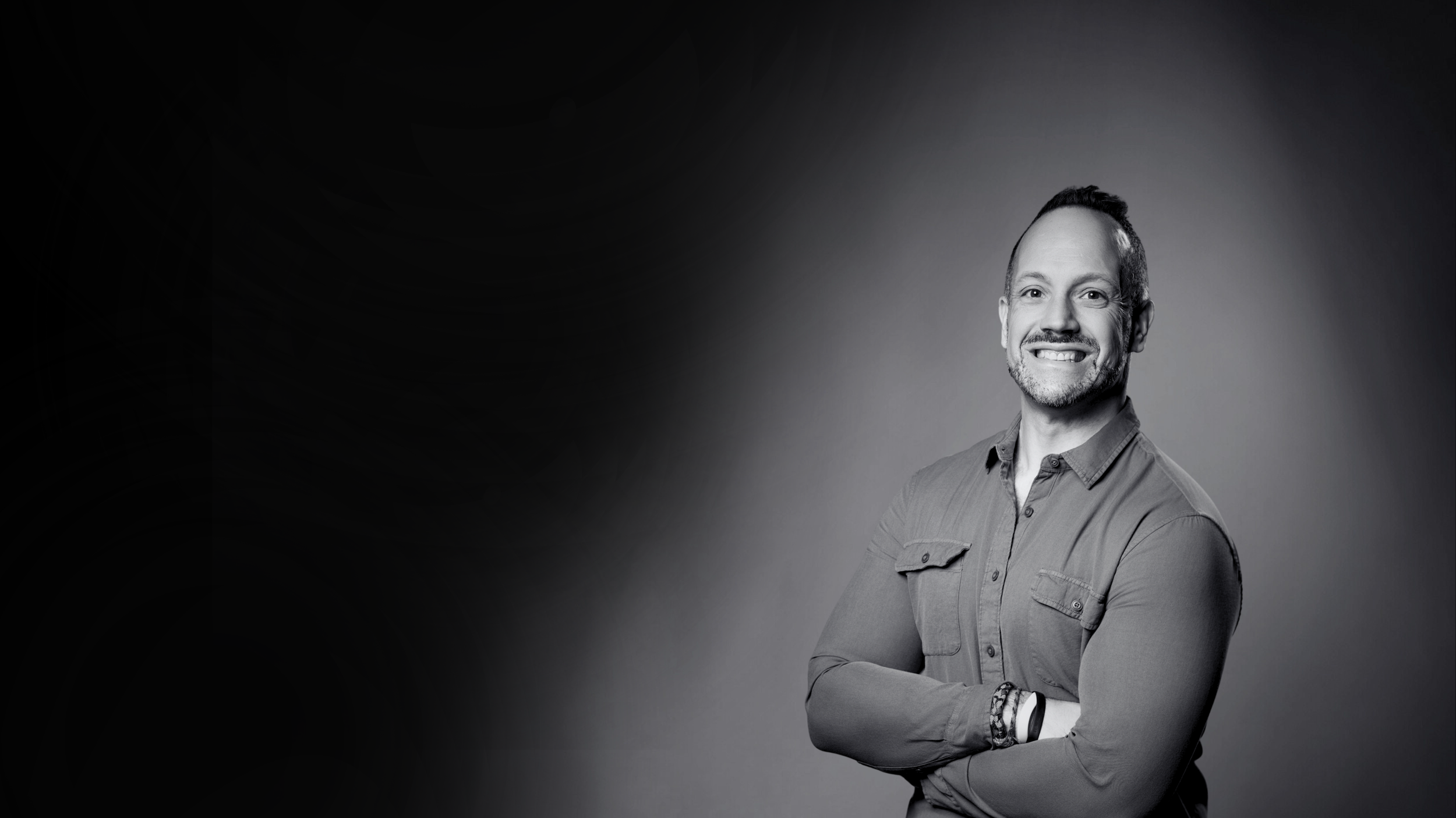 Chase Butala a therapist with folded arms