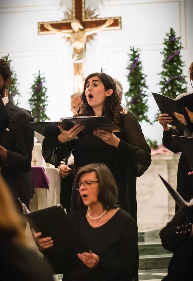 Richmond Choral Society members mid-performance at a church.
