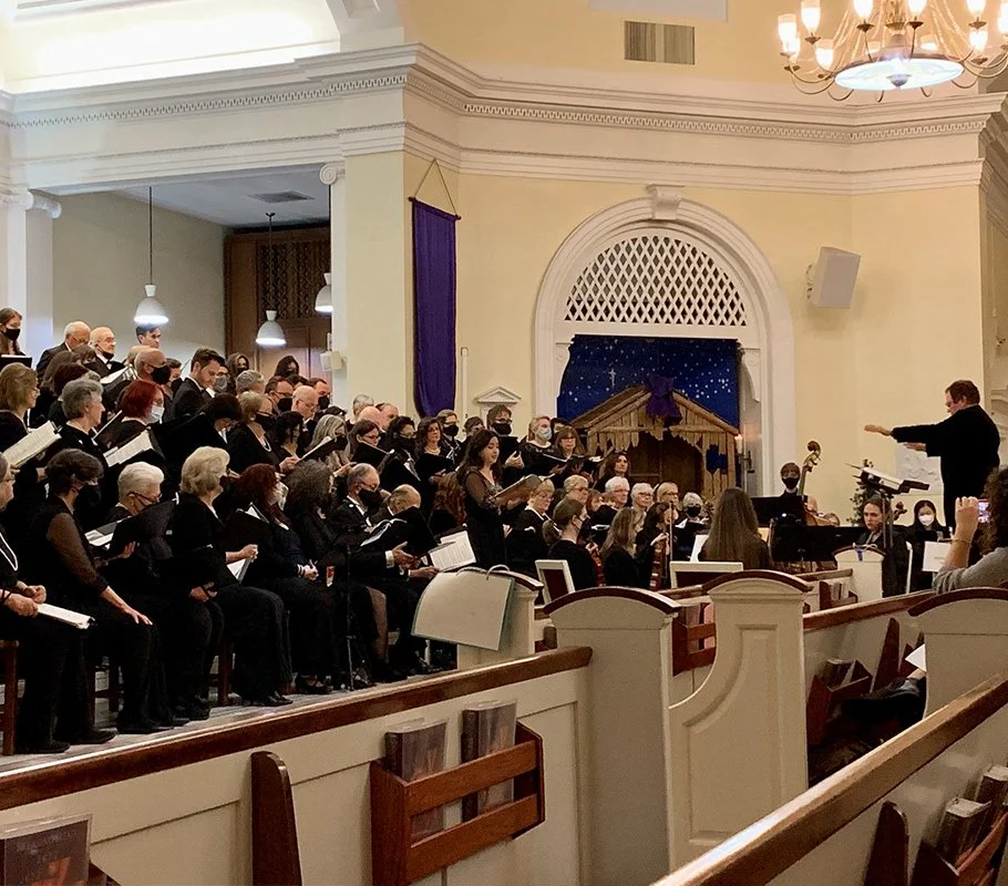 A soloist performing during a Richmond Choral Society church concert.