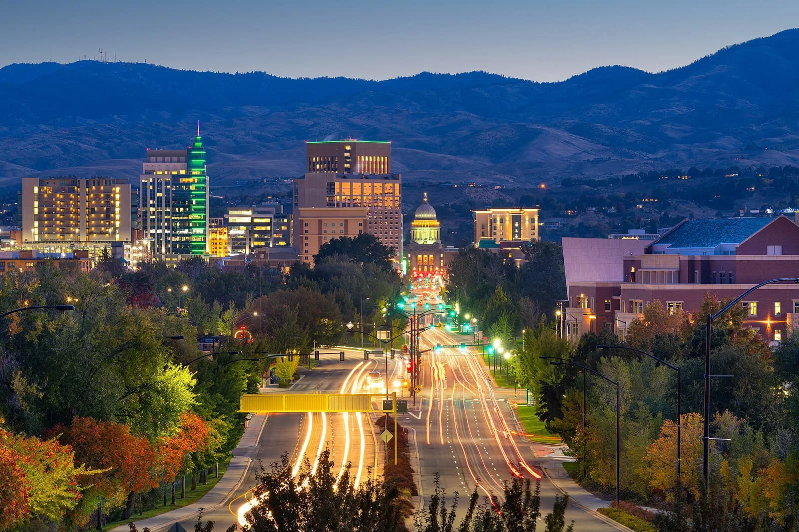 An aerial view of downtown Boise at night focused on the Idaho State Capitol Building