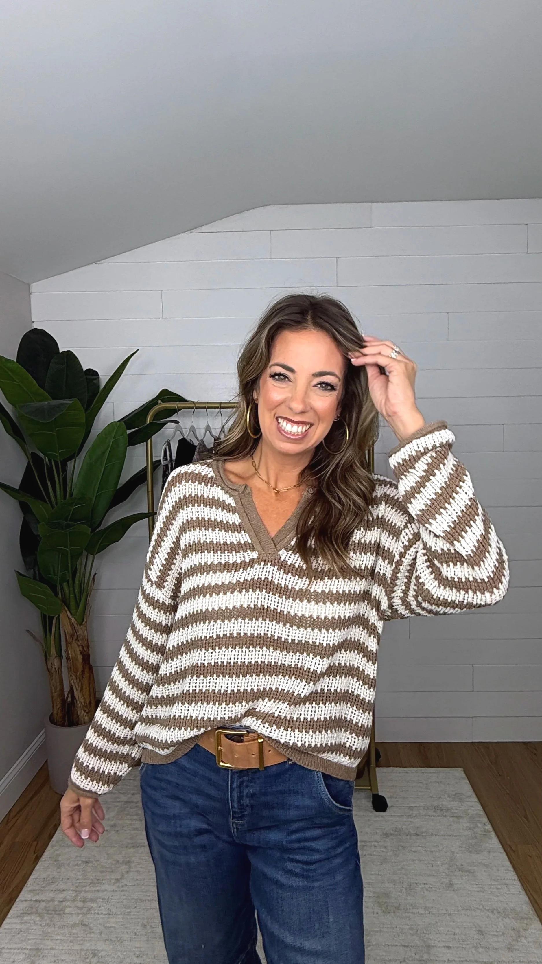Mocha cream stripe oversized knit sweater styled with barrel jeans and tan belt