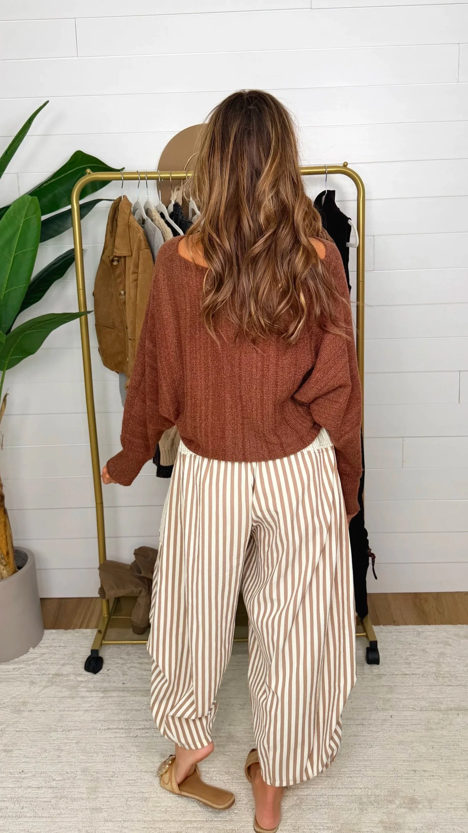 Back view of mocha mousse striped baggy pants showing elastic hem and relaxed fit