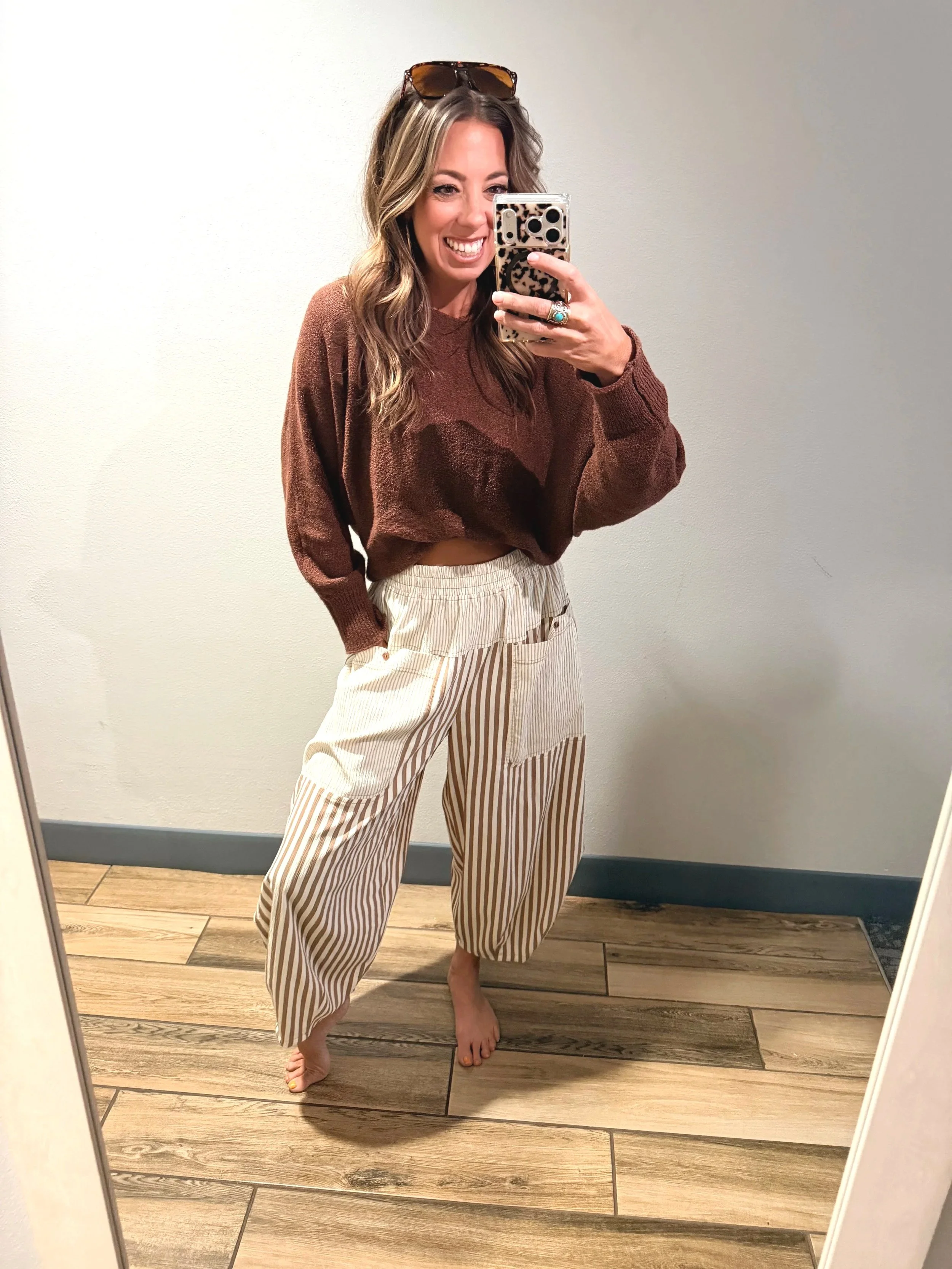 Selfie of Mocha Mousse baggie pants styled with front tuck brown sweater