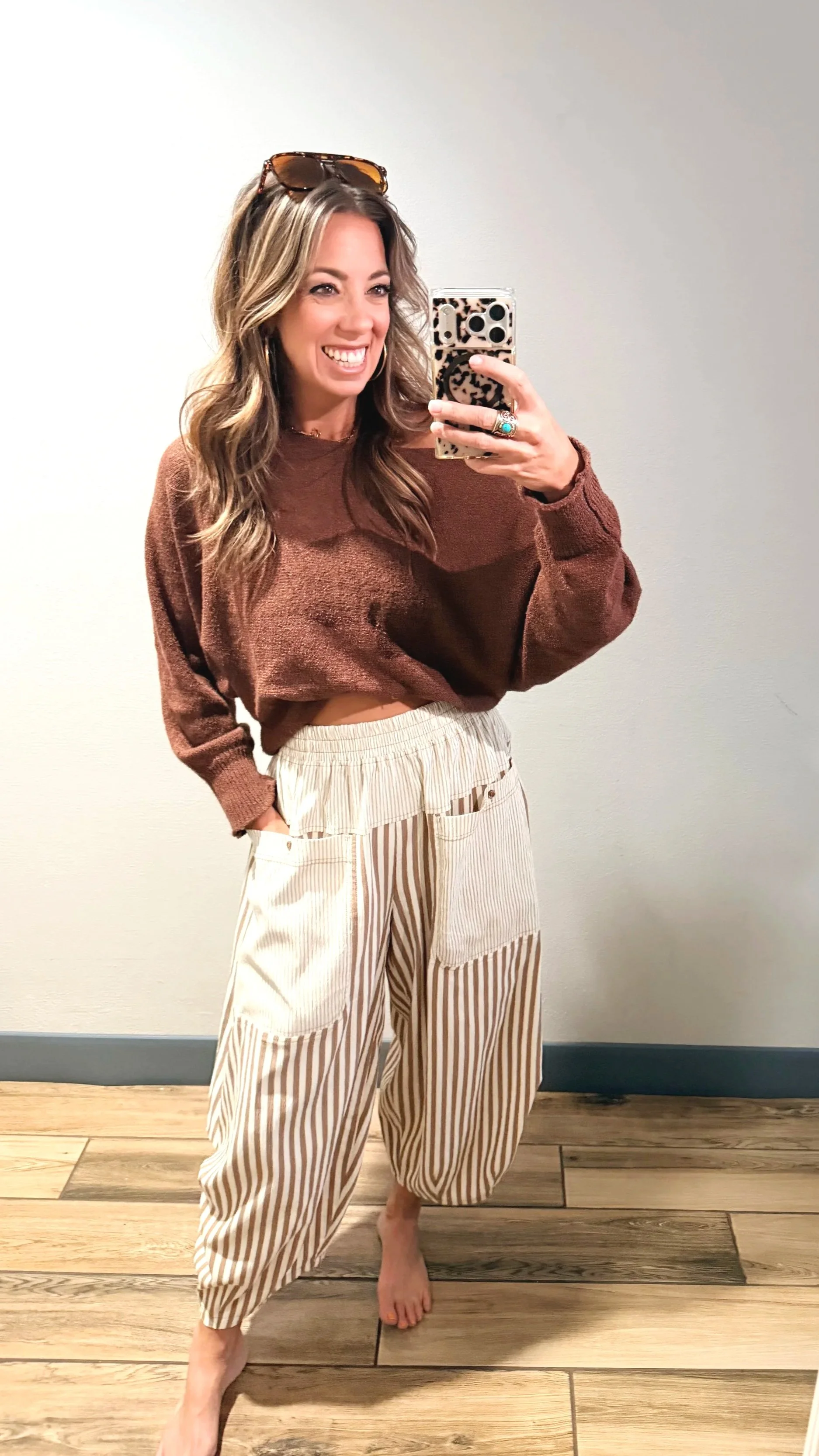 Mocha mousse striped baggy crop pants styled with a cropped brown knit sweater