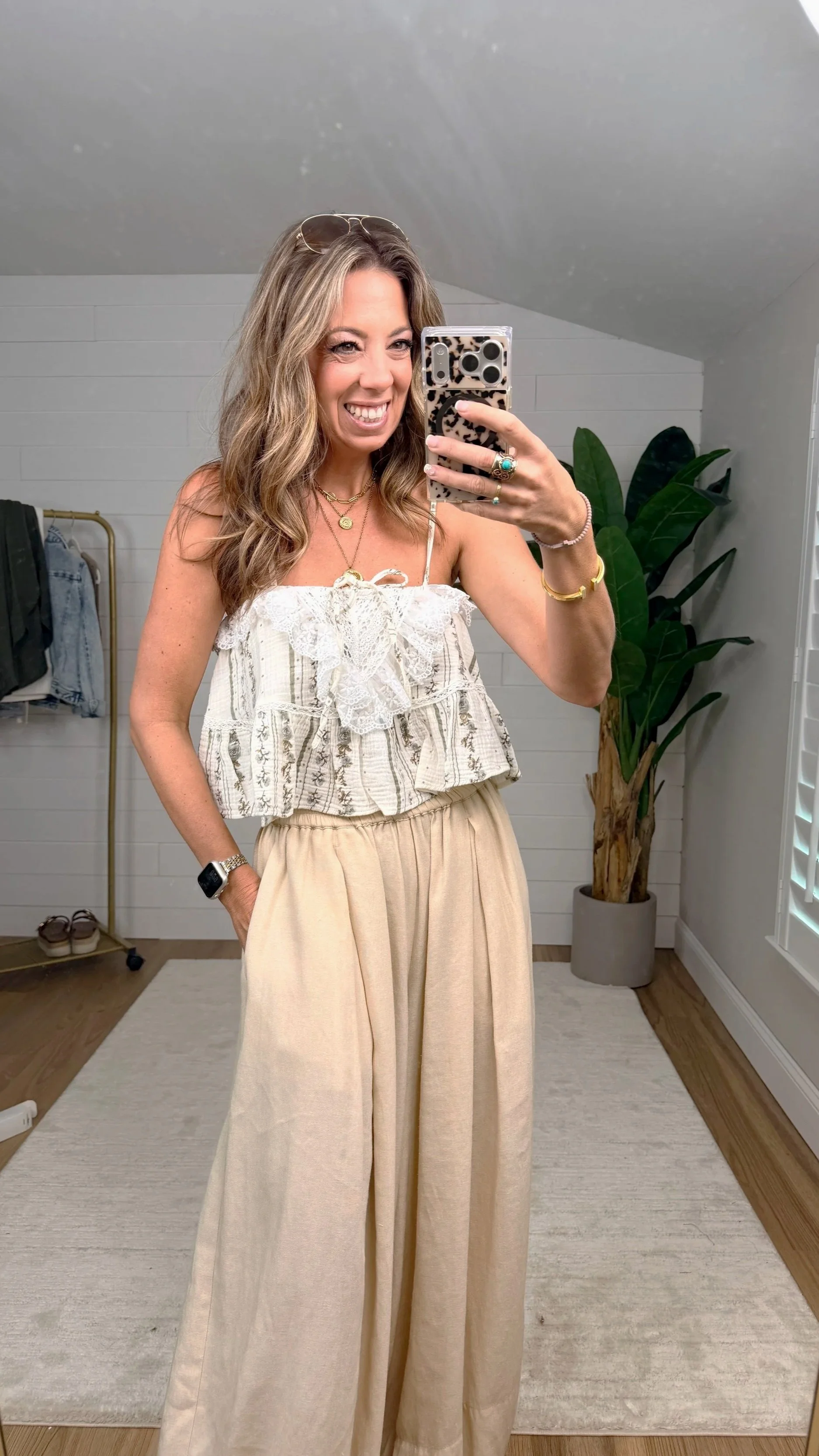 Natural lace ruffle cropped tank top styled with wide leg trousers
