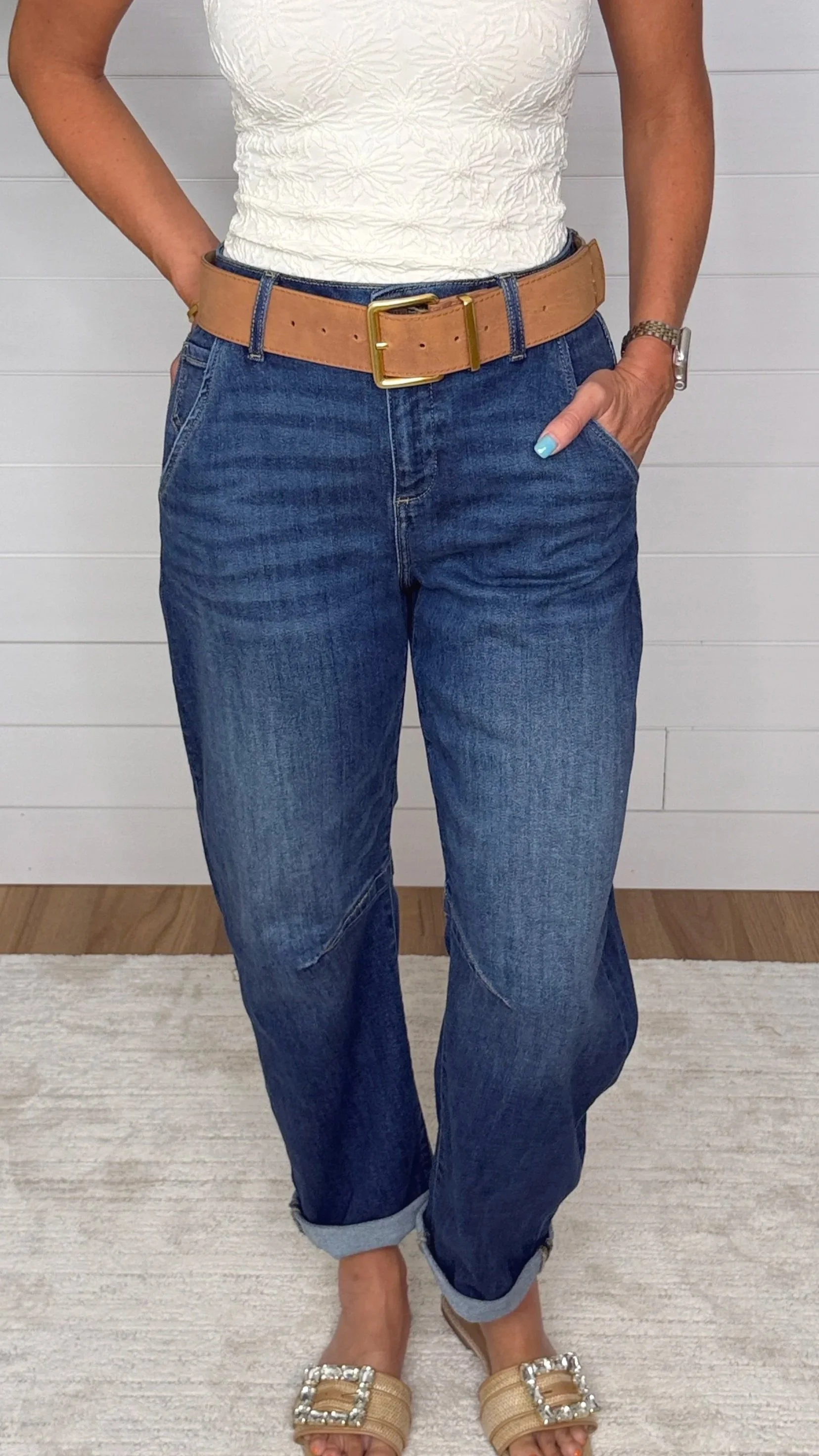 Close up of Risen barrel jeans showing relaxed fit, patch pockets and tan gold buckle belt