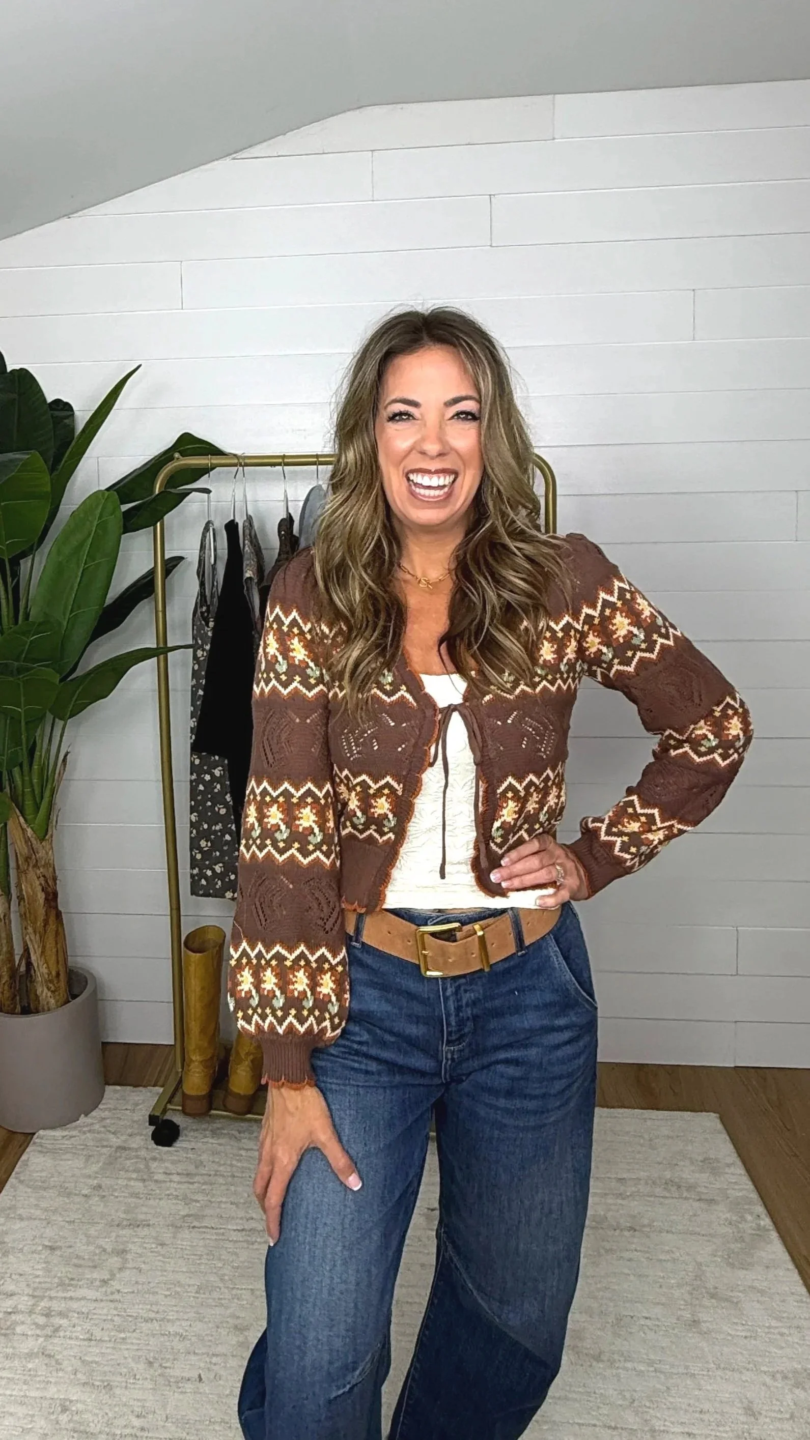 Brown floral fair isle cropped cardigan open over white tank and barrel jeans with gold buckle belt