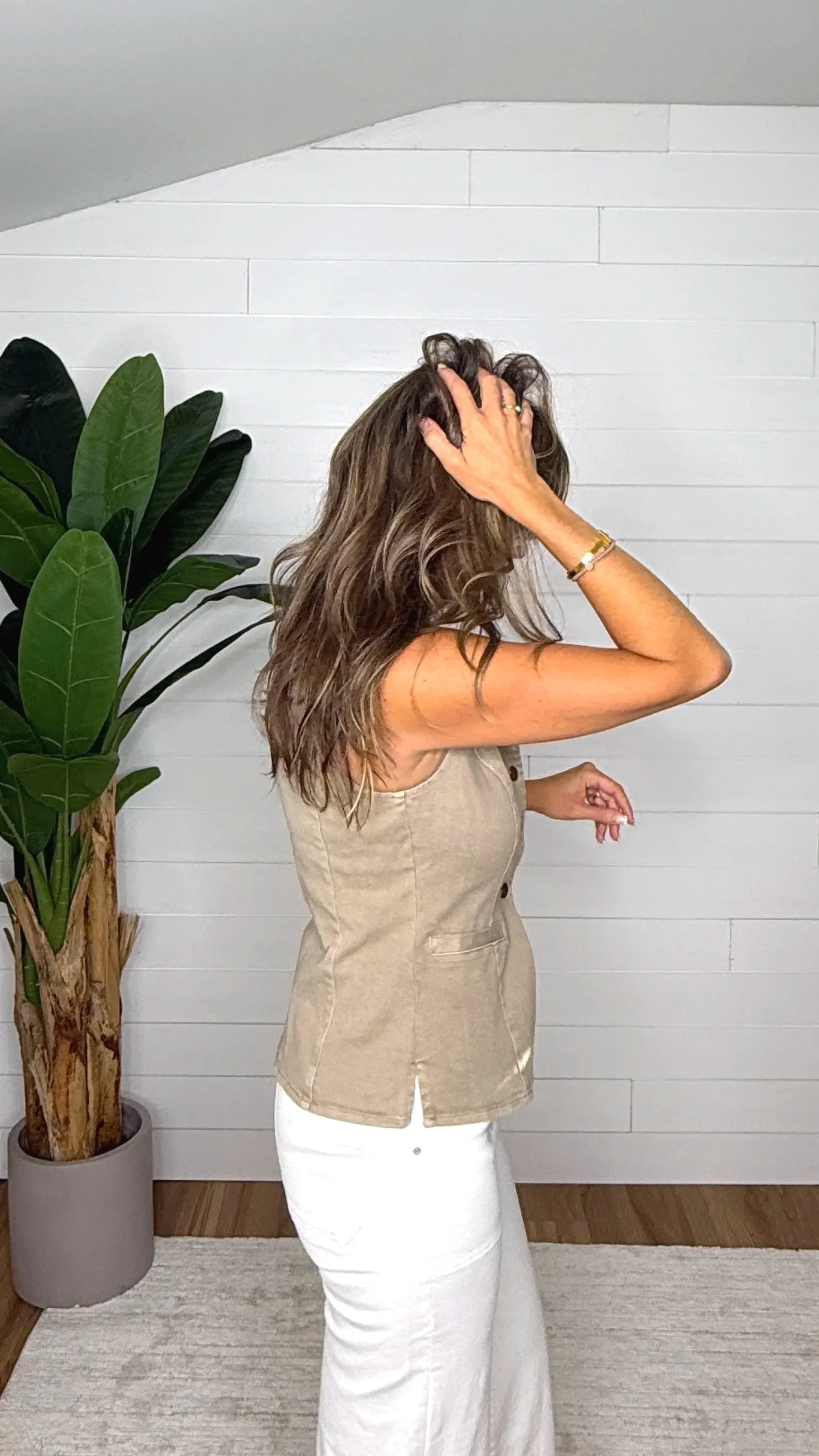 Side back view of mocha denim vest showing fitted silhouette and back detail