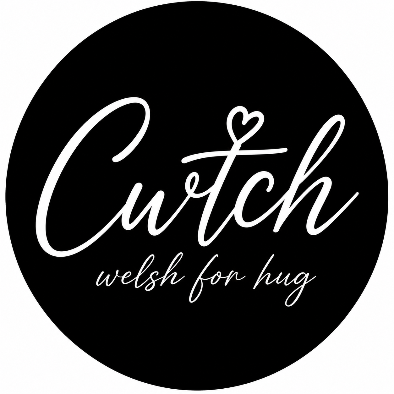 Black circular sticker with white cursive text that reads "Cutch" with a heart over the letter 't' and smaller text underneath that says "welsh for hug".