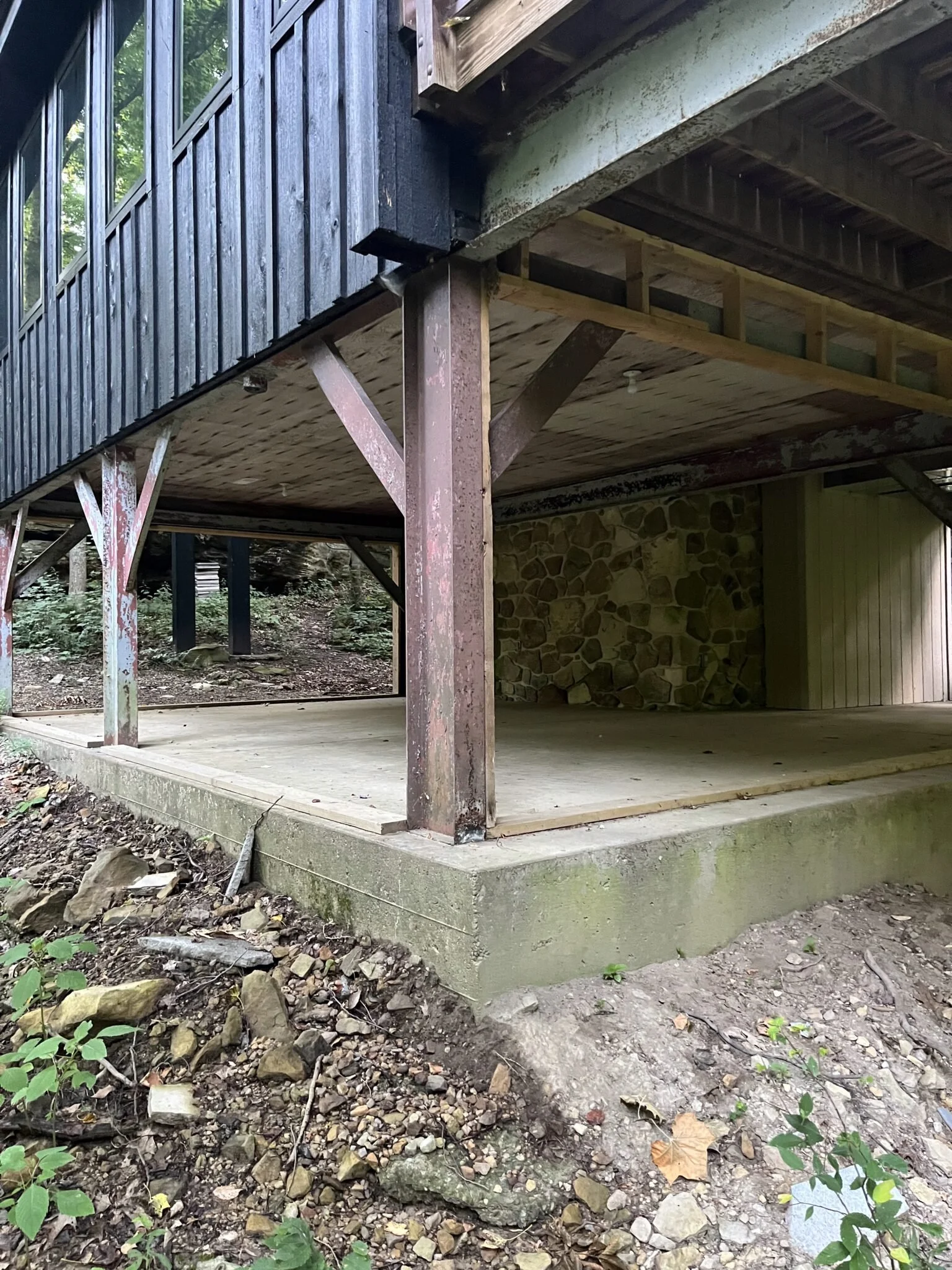 Concrete slab basement photo before S. Flynn Home remodeled it into a cozy, livable space