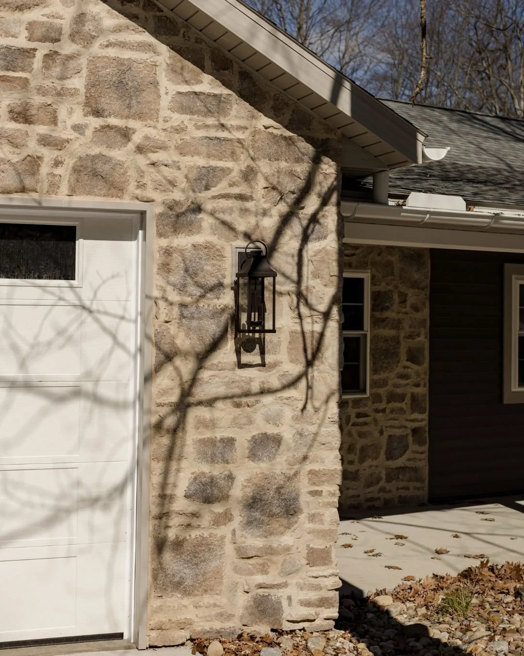 #DoddyHaus reveal is here 👷🏡

This exterior transformation was a big one&mdash;featuring a new garage and mudroom addition, plus a full wraparound porch that completely redefines the home&rsquo;s presence. The overgrout stone is the standout moment